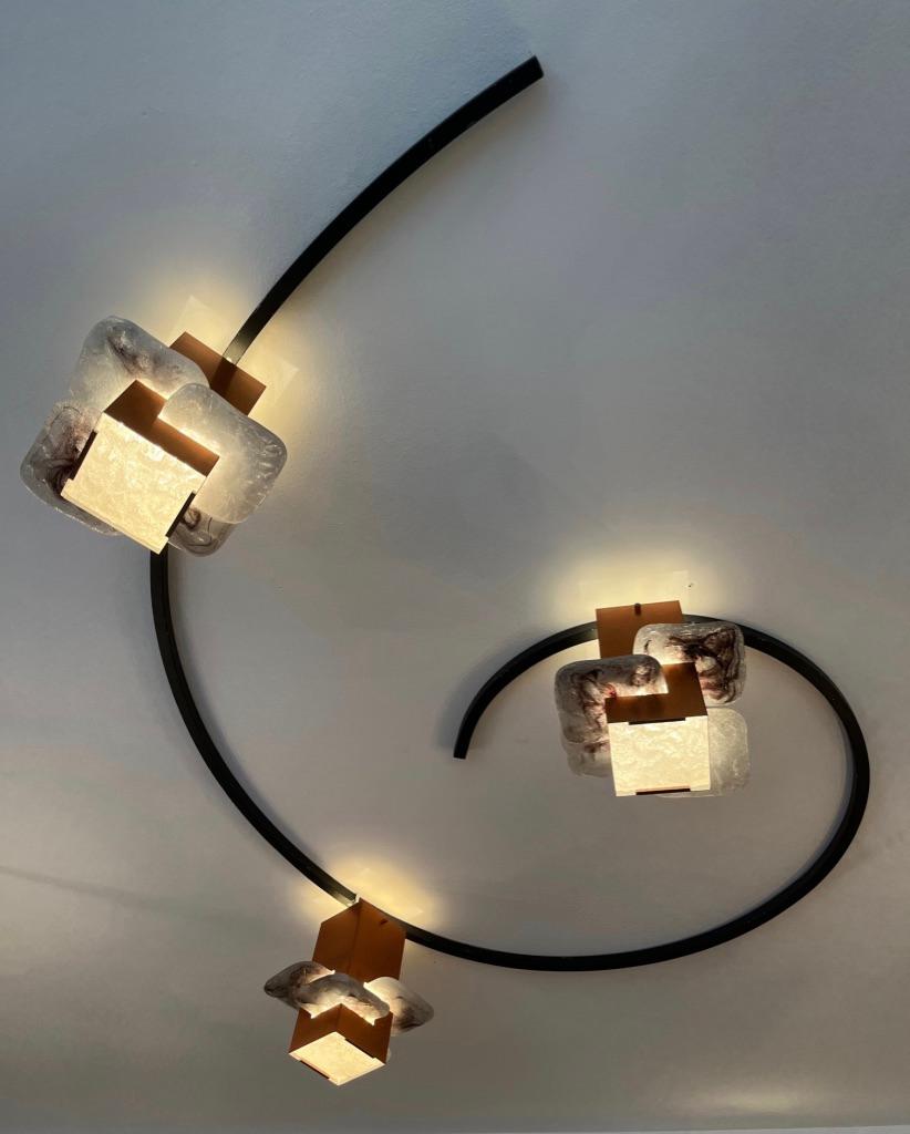 Vintage unique and highly decorative circle flush mount lamp with 3 copper square cylinder glass pieces nested.
Standard bulb E27. Can be used with LED bulbs.
Was using at the Grand Theatre of Geneva between 1962 ( date of the reopening after the