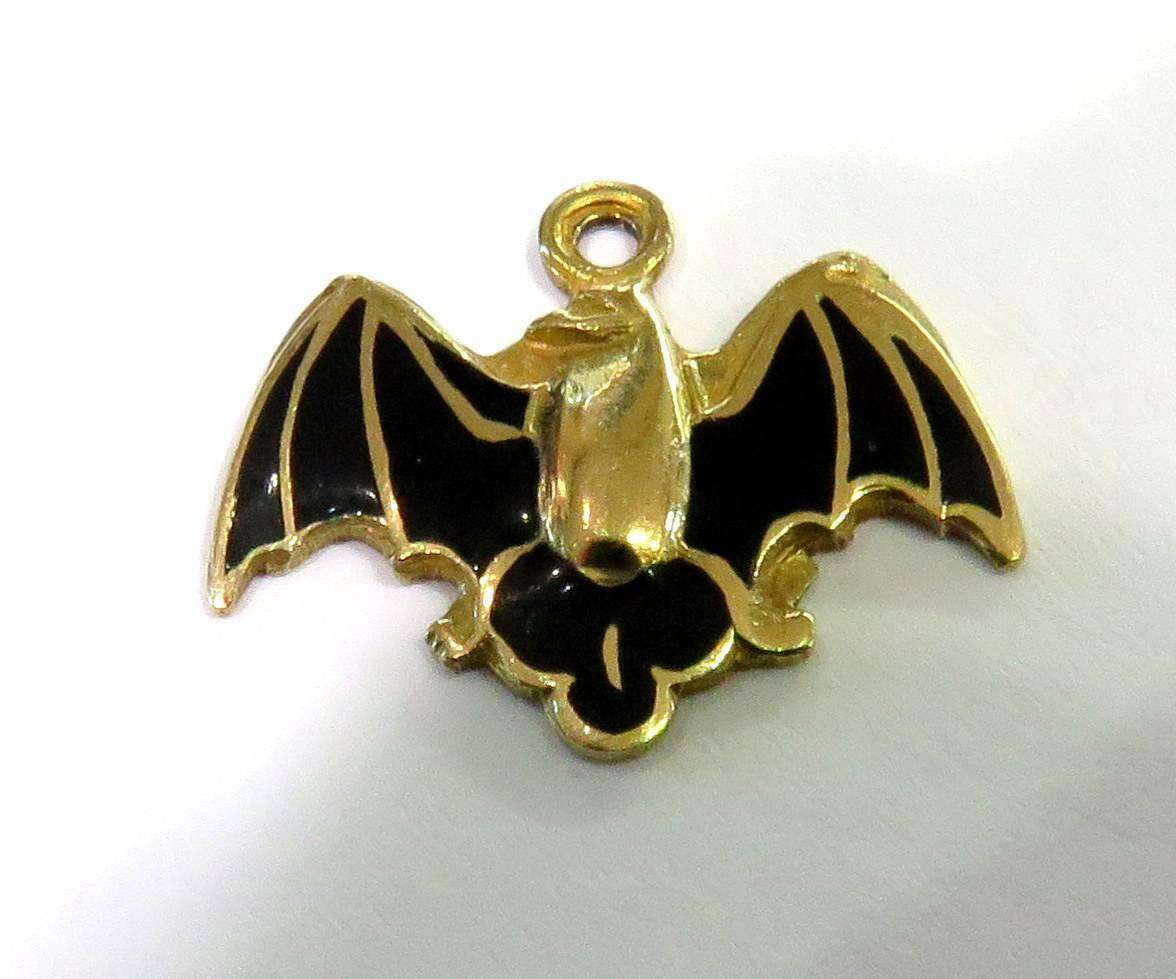 This very hard to find 1950s 14k gold black enamel bat charm is in pristine condition. He is in his classic wings spread position. 
This bat weighs 1.5 grams
This bat measures 11/16 inch across by 5/8 inch high

Patti Esbia has sold the finest