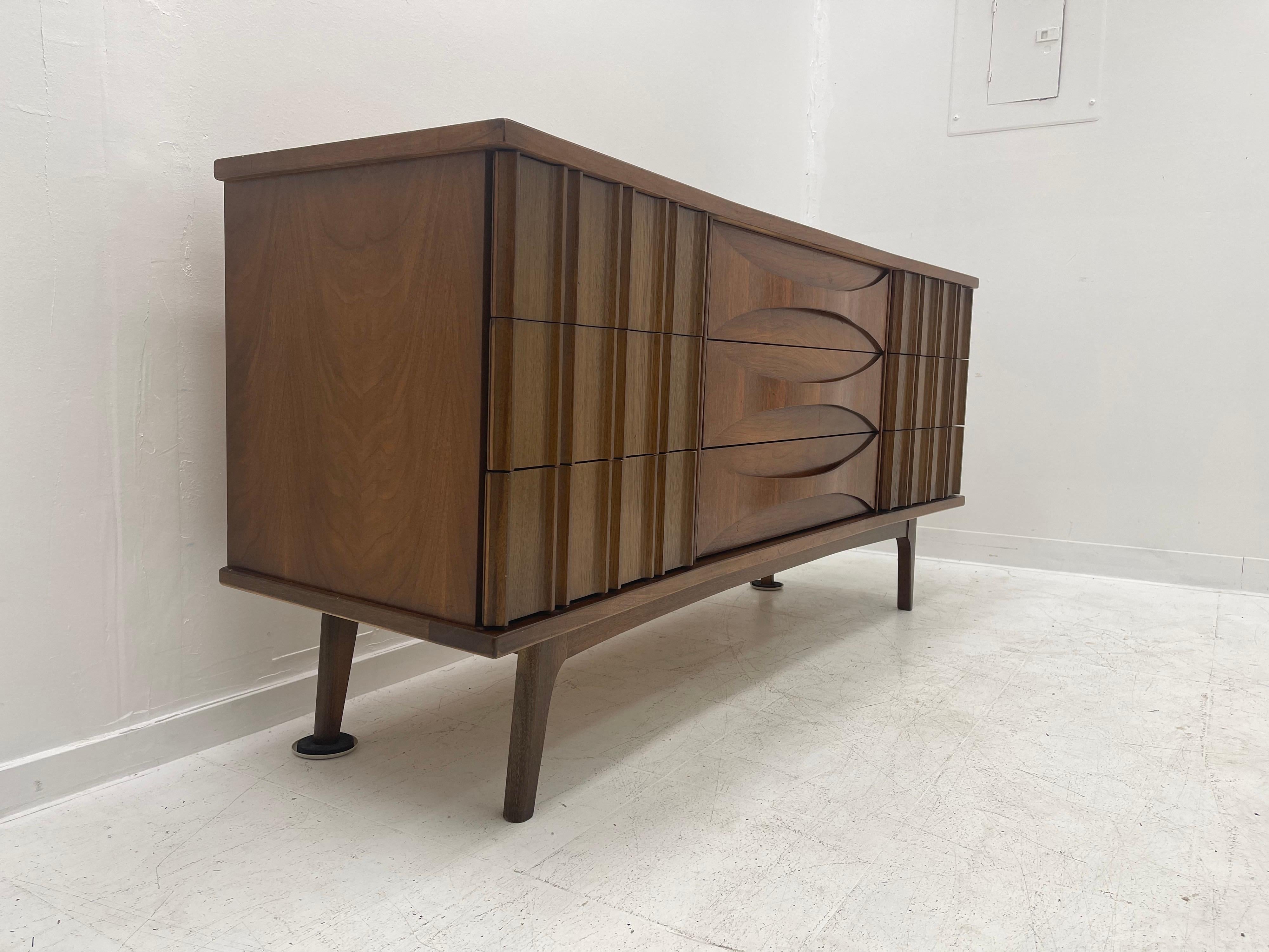 We have a beautiful mid century dresser set available. The set has clean-lines and looks very sophisticated. 
 
The set includes a tall boy, lowboy, and Endtable.

Tallboy Dimensions: 39