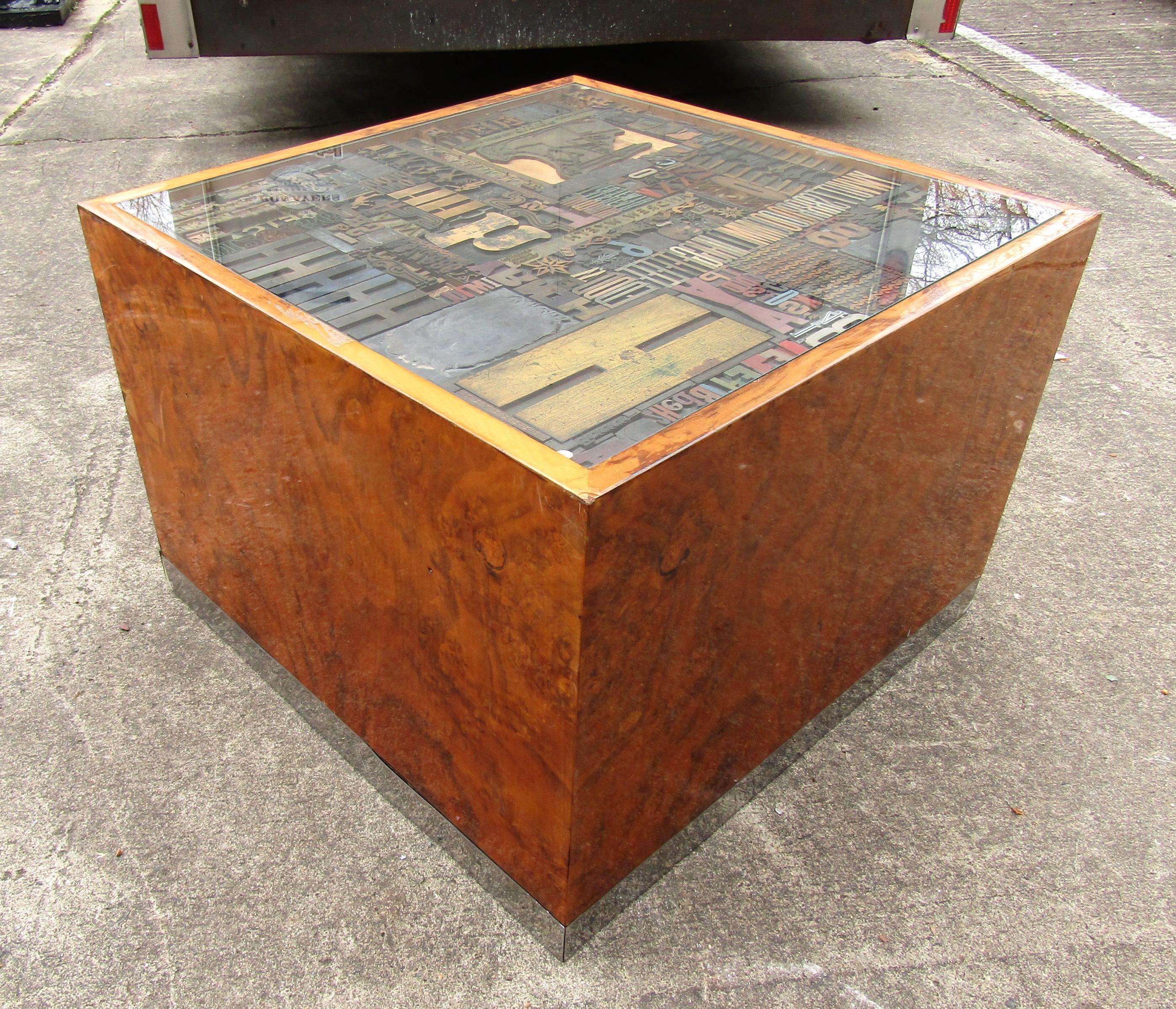 Mid-Century Modern burl wood cube coffee table featuring unique wood tile designs inside a glass-top.

(Please confirm item location - NY or NJ - with dealer).