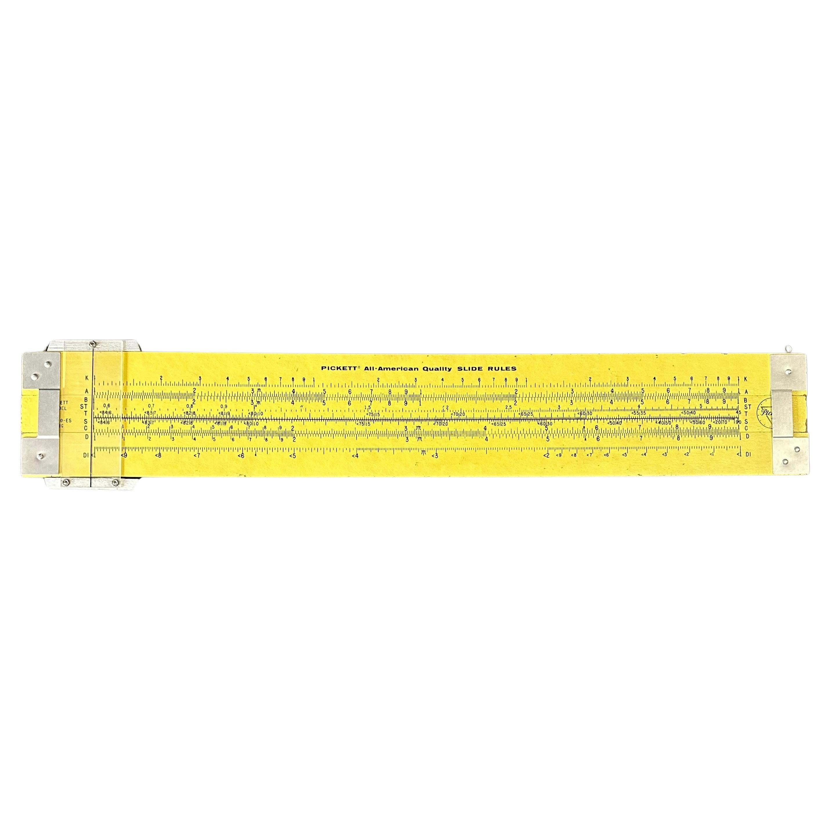 A unique vintage oversized 4' industrial slide rule by Pickett, circa 1960s.  The slide rule is a working model that was most likely used in a school class room or as a display model.  It has two rings attached to the top for mounting, is made of