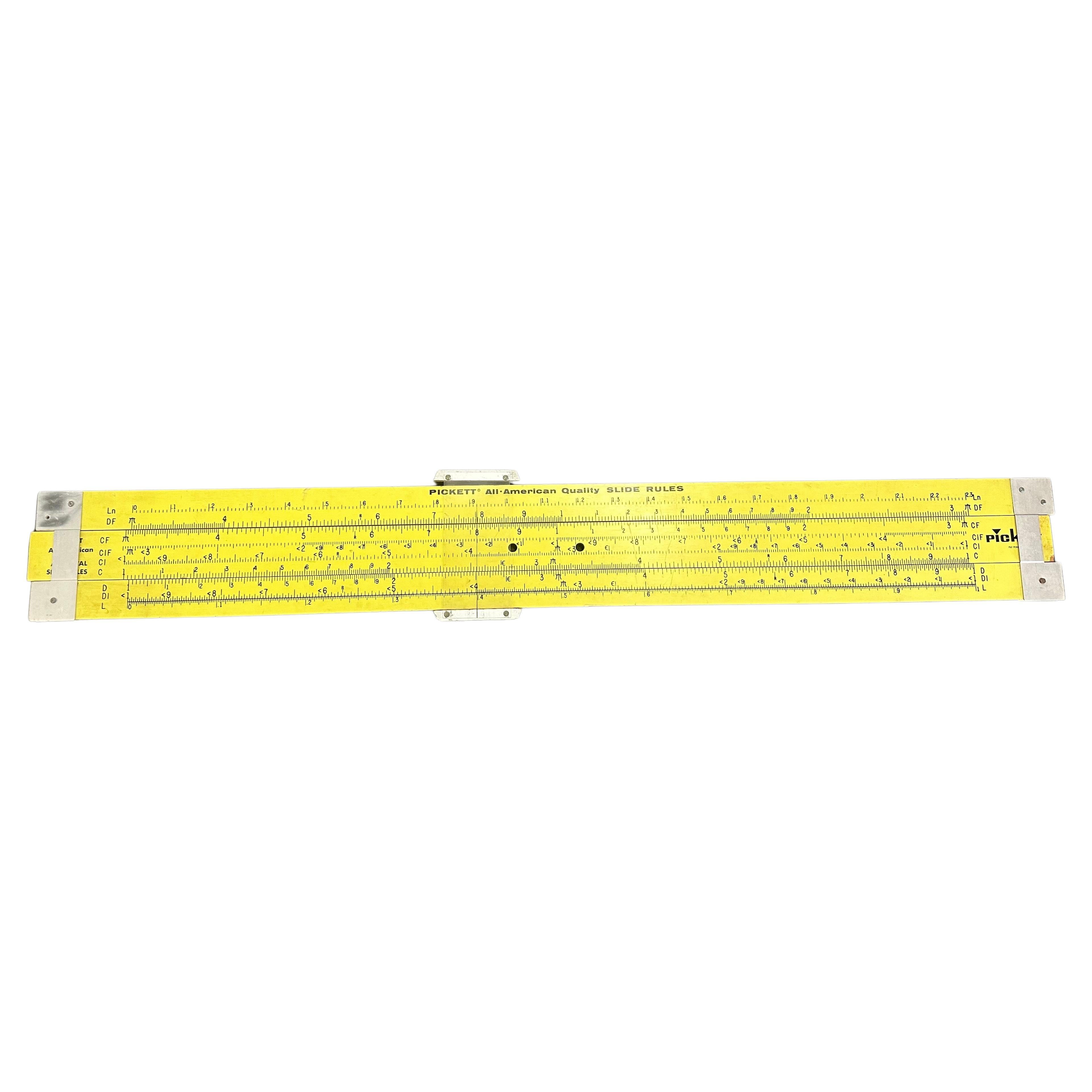 A unique vintage oversized 7' industrial slide rule by Pickett, circa 1960s.  The slide rule is a working model that was most likely used in a class room.  It has two holes to mount, is made of yellow painted plywood with aluminum end caps and is