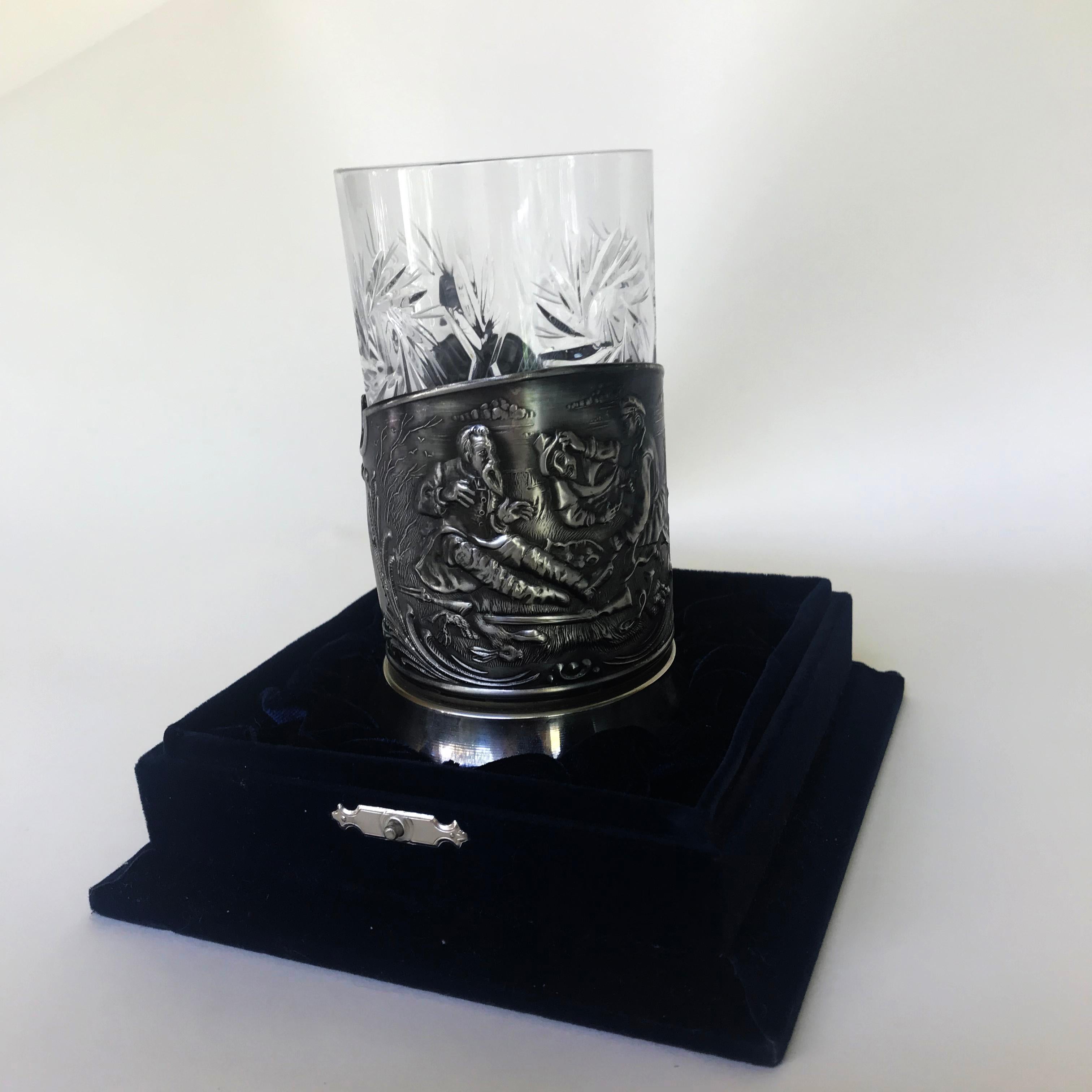 This unique Russian metal crystal glass holder is from the 20th century. It comes with a crystal glass and in the original velvet blue box. It is engrave with a unique technique which portraits Russian history. It is perfect for a gift, Russian