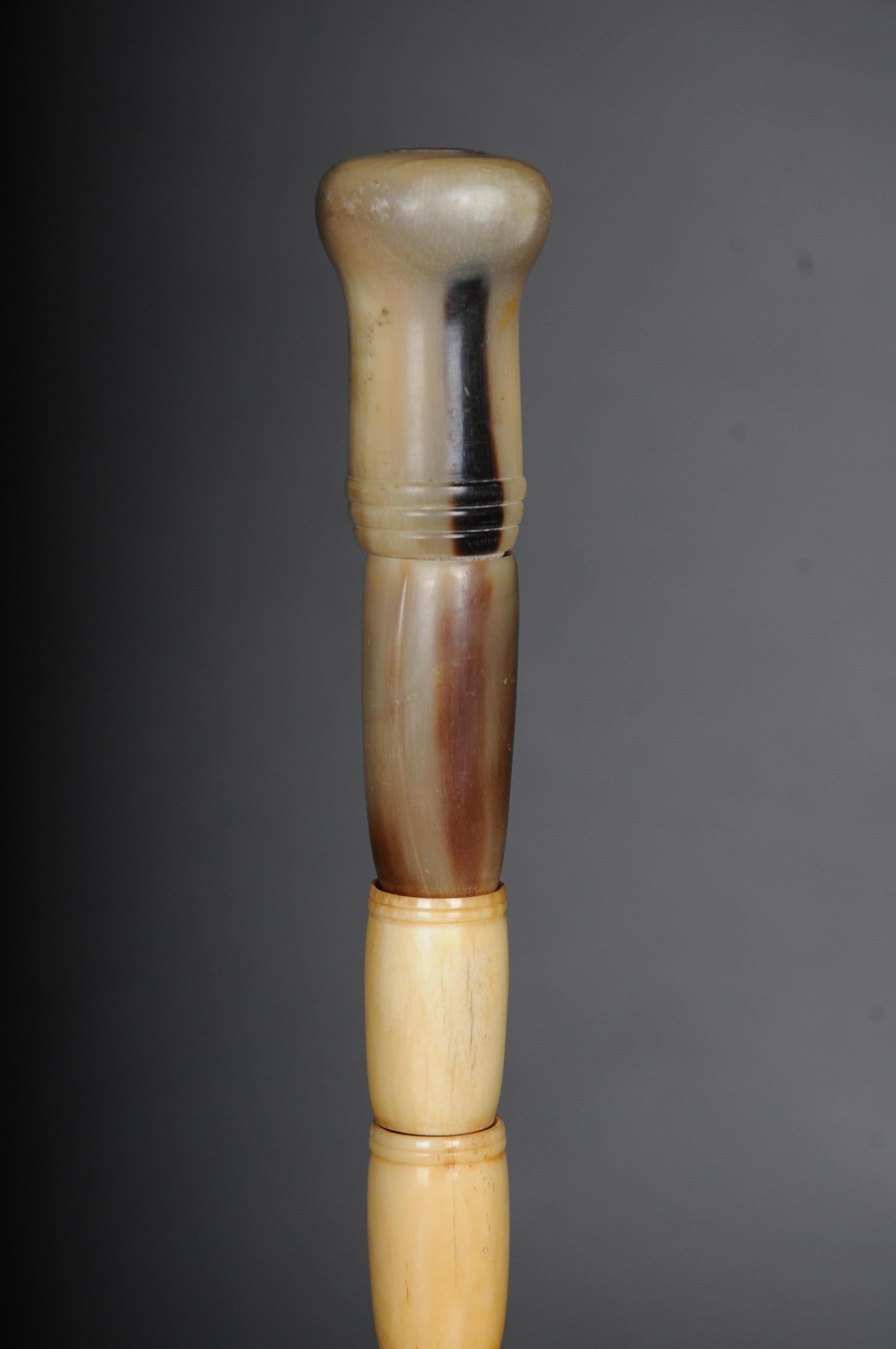 Unique walking stick / strolling stick 19th century, bone

Antique walking stick made of bone, circa 1900

Solid bone :-). Unique shape with several unusually stacked nozzle shafts. The handle and the end of the stick are made of horn.
Very