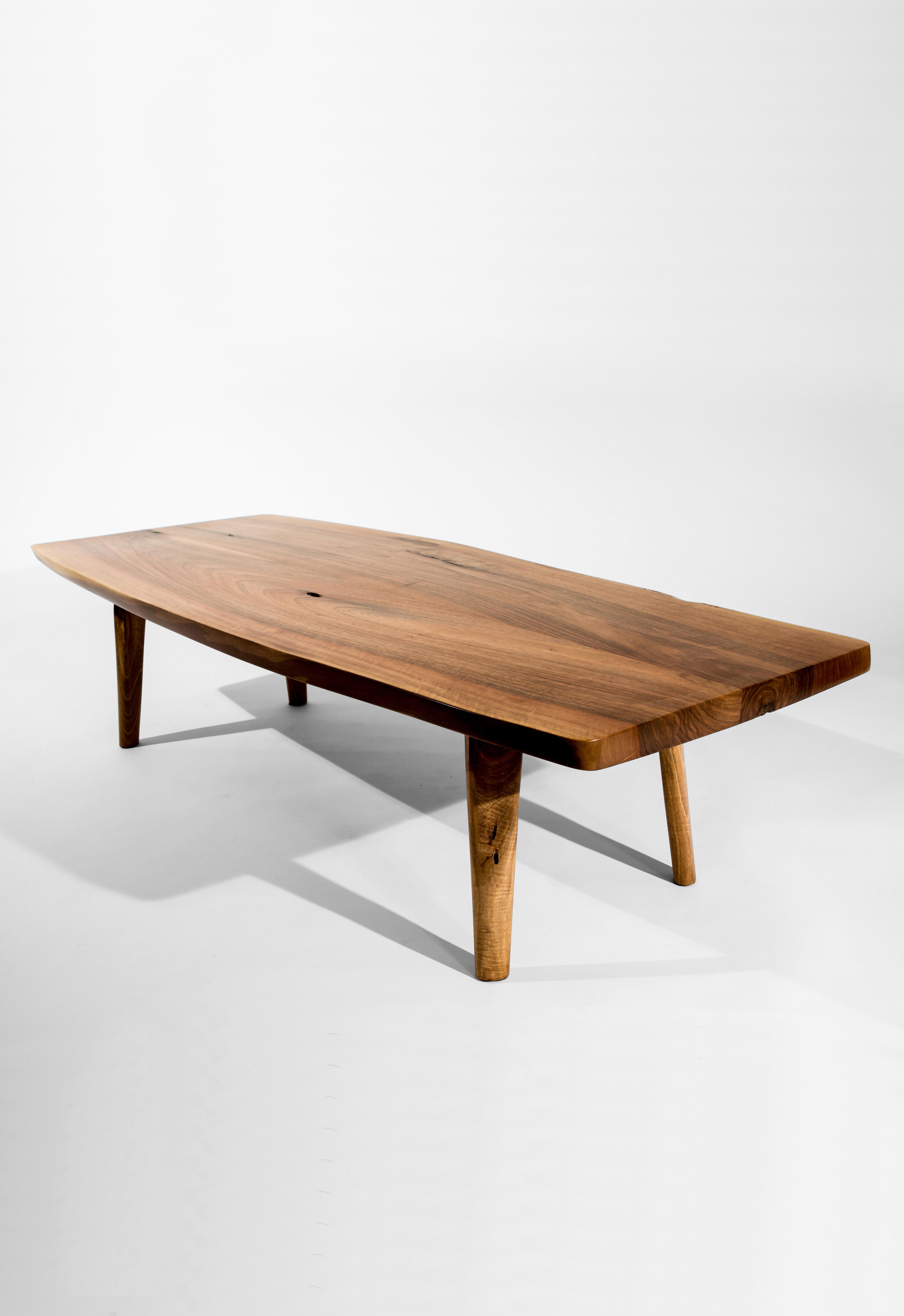 Unique walnut signed table by Jörg Pietschmann
Materials: European walnut
Measures: H 36 x W 130 x D 52 cm

In Pietschmann’s sculptures, trees that for centuries were part of a landscape and founded in primordial forces tell stories inscribed in