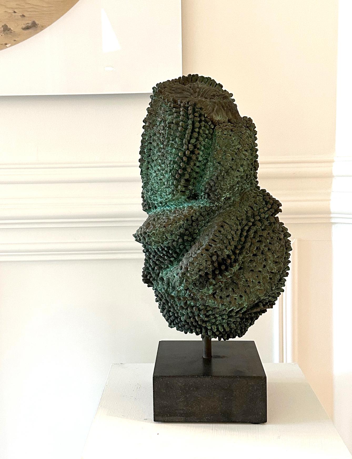 A unique bronze sculpture displayed on a granite stone base circa 1973 by Harry Bertoia (1915-1978), the celebrated Italian-born American artist, sculptor, and designer. The welded and patinated bronze sculpture is highly abstract with a visually