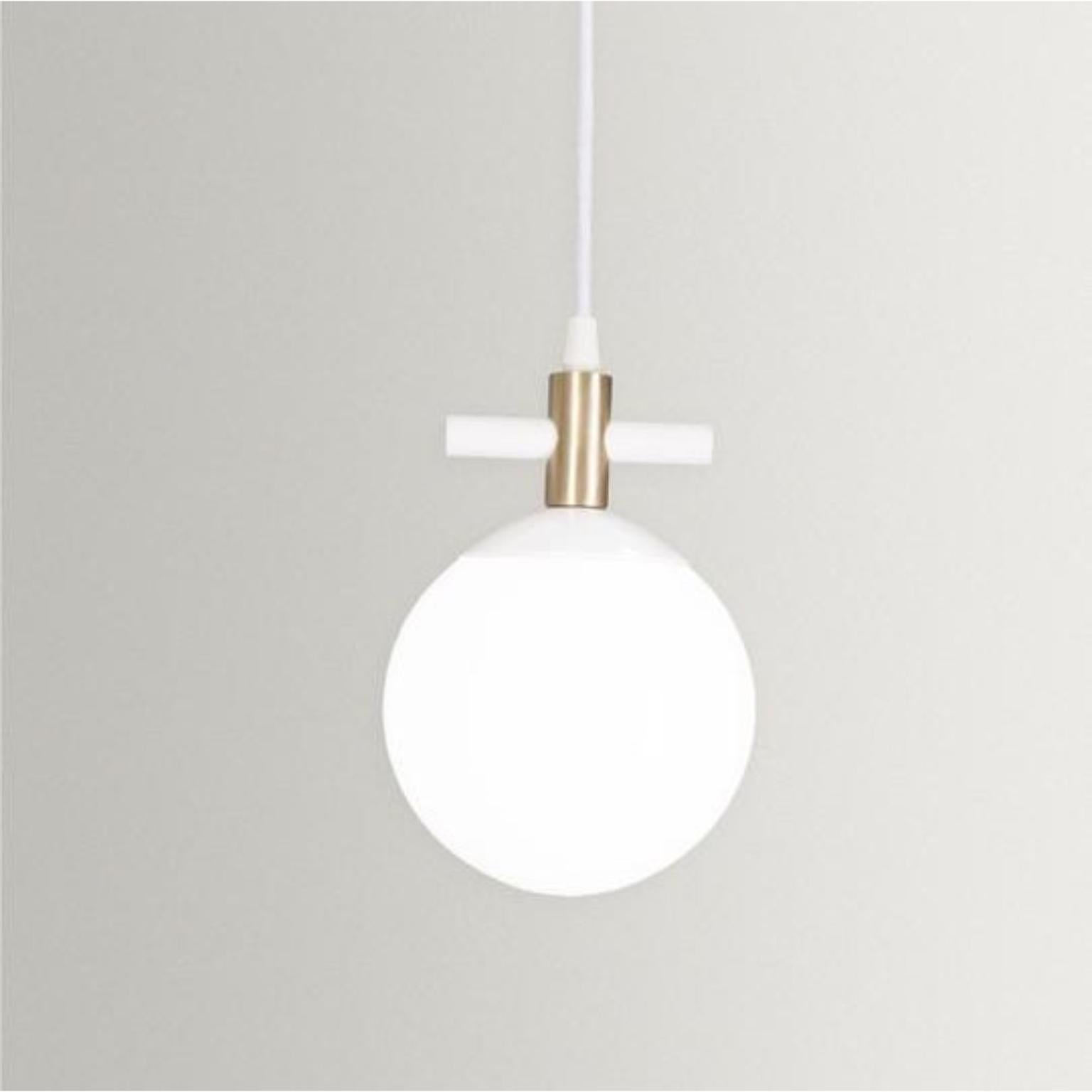 Unique esferra pendant by Hatsu
Dimensions: W 14 x H 19 cm 
Materials: Opal glass with powder coated aluminium

Hatsu is a design studio based in Mumbai that creates modern lighting that are unique and immediately recognisable. We started with