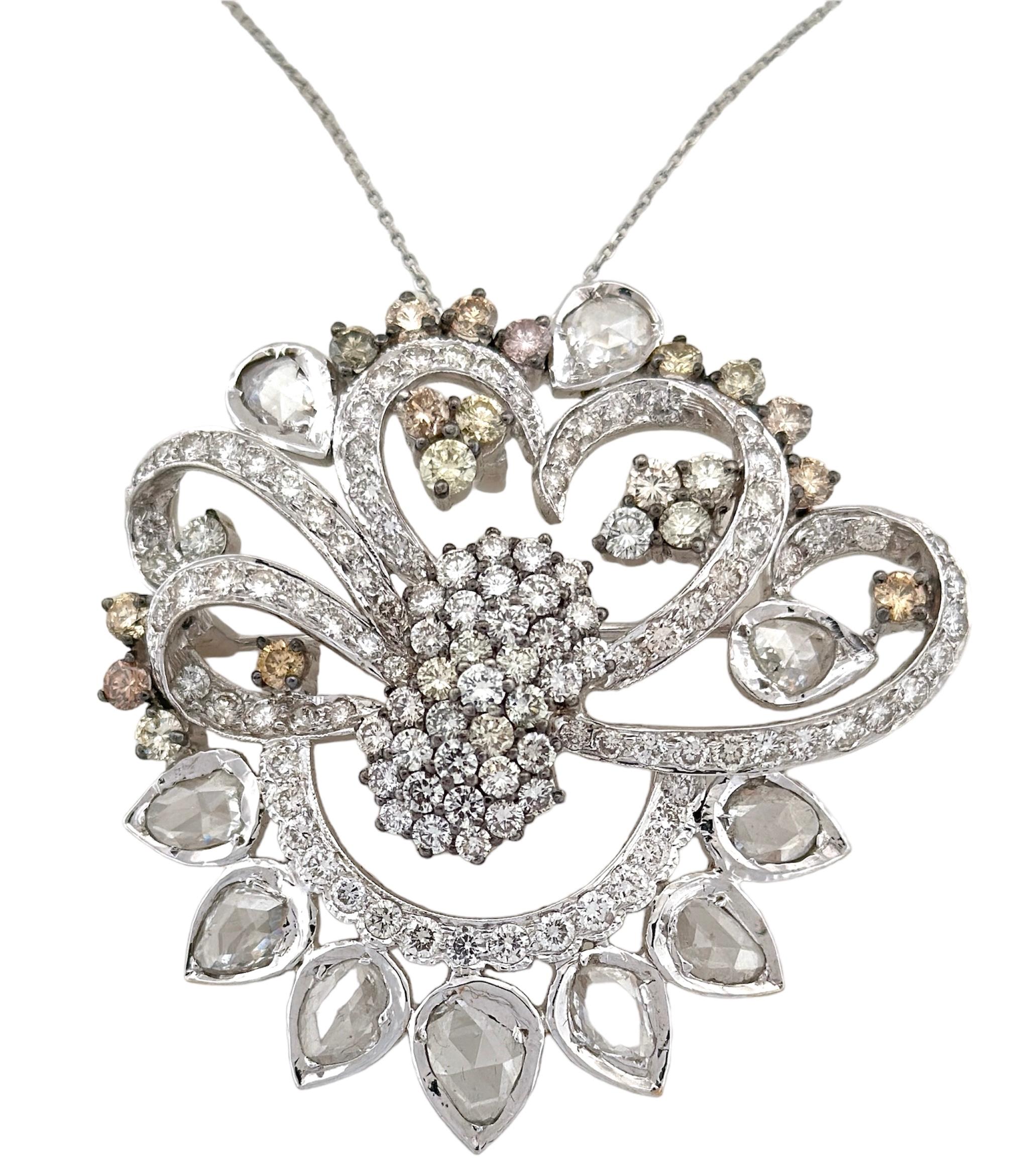 The Unique Whited Diamond Pendant And Brooch is an extraordinary piece that carries the essence of the early 20th century, a testament to the enduring beauty of vintage jewelry. With a remarkable total diamond weight of 10.95 carats and a