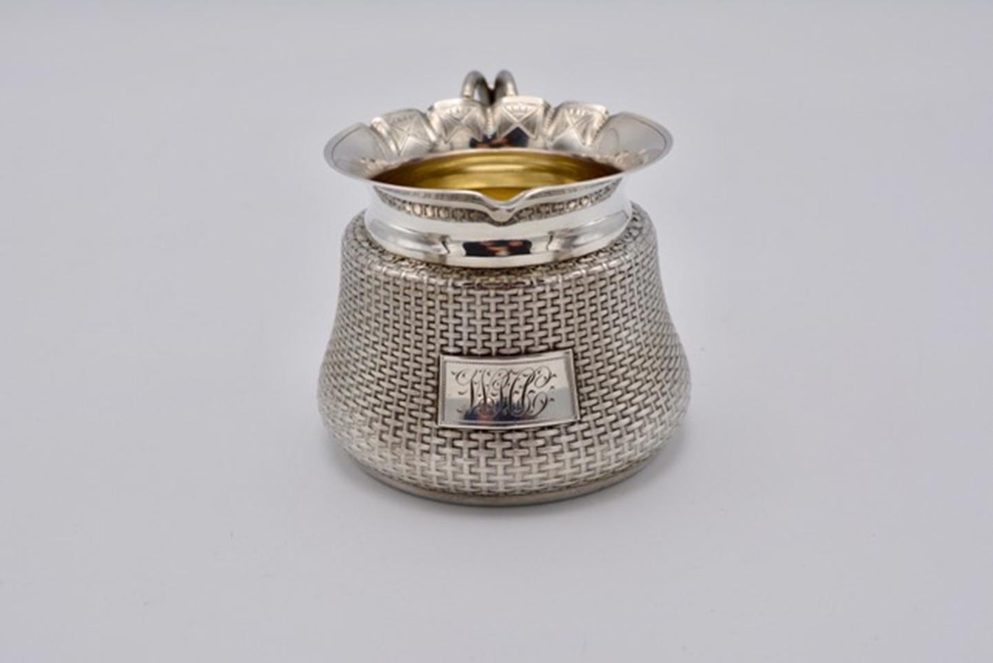 Unique Wood and Hughes sterling silver Japaneseque basket-weave design tea set. Approx. total weight: 32 troy ounces. Teapot measures 5”, Creamer 3” and sugar bowl 5.5” (including the handle).) In the form of traditional woven baskets. Beautiful
