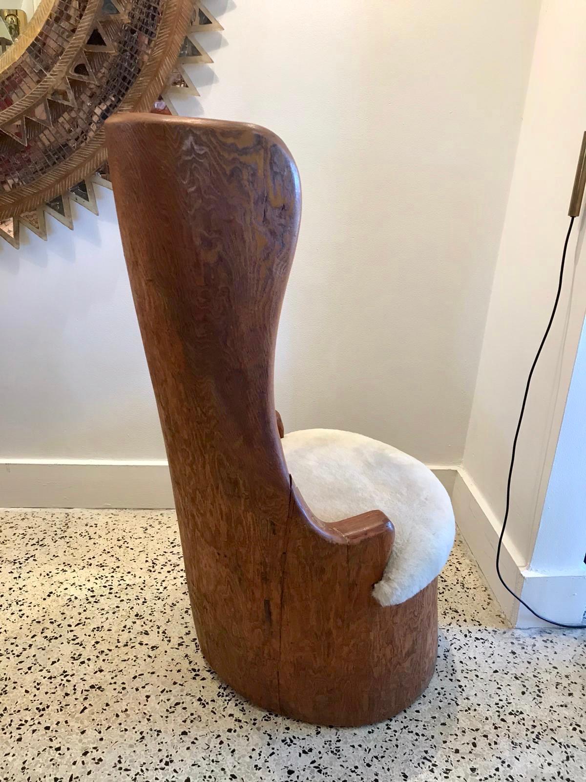 Vintage and artist made (signed and dated), one piece of wood trunk hand carved made to a small chair. In vintage as-found condition, we added a new shearling wool seat base. Artist signed Noddin' Chair, a bean patch original 1962. Very whimsical