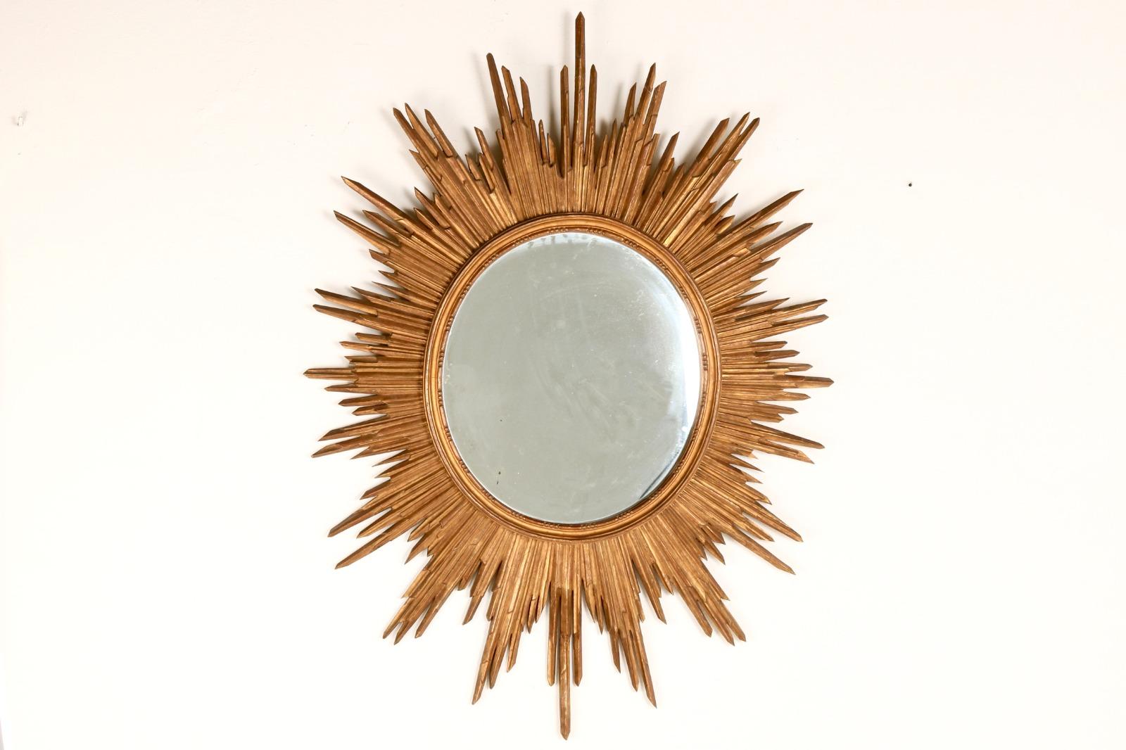 This exquisite Italian-designed wood-framed mirror captivates with its sun-shaped geometry and intricate details. Crafted with extreme mastery, the mirror's geometric shapes, harmoniously integrated into the wood-frame, creating a striking visual
