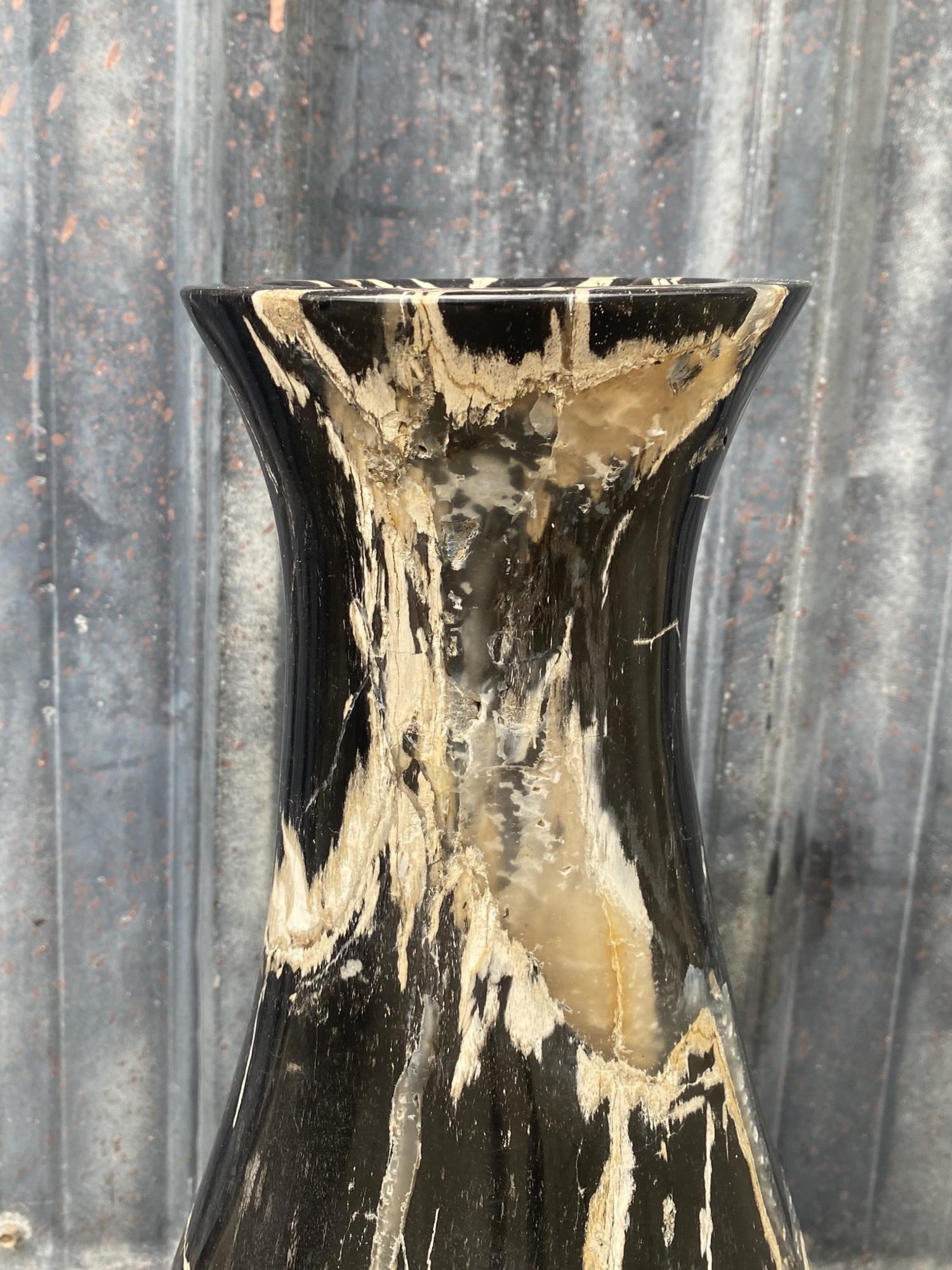 Unique wood vase by DeepWood
One of a kind
Dimensions: L 20 W 20 H 55 cm
Materials: Petrified wood fully polished
Wight: 20 kg

Each DeepWood piece is expertly crafted from a rarefied specimen of petrified wood and contains 25 million+ years