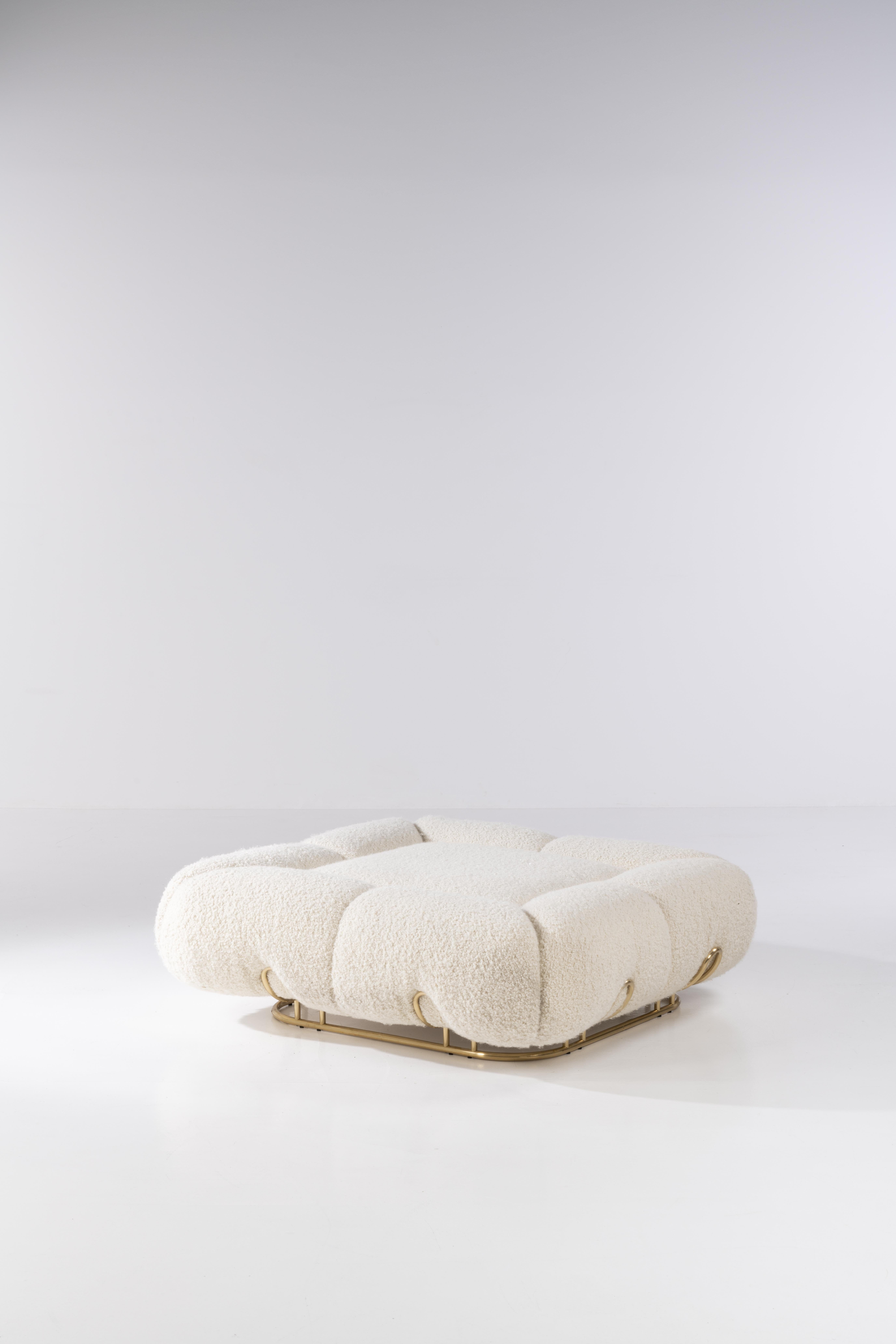 Unique pouf marshmallow by Draga & Aurel
Dimensions: W 120 D 120 H 38
Materials: Wool 

Deliciously soft and fluffy. This is the design of Marshmallow pouf, whose soft shapes live up to its name. It stands out for its polished brass structure