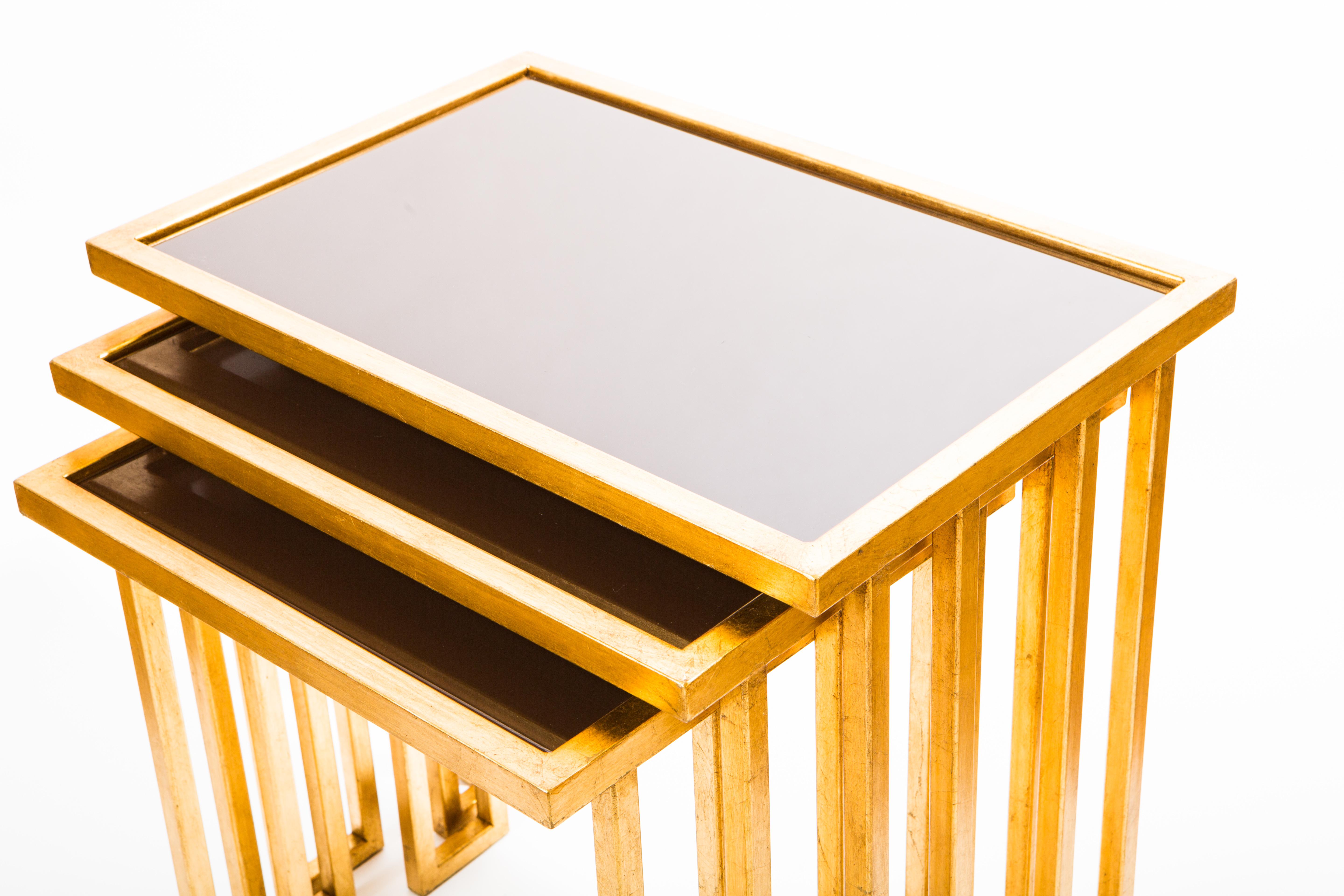 Forged Unique Wrought Iron Nesting Tables in 24 Ct Gold Leaf with Bronze Glass Tops For Sale