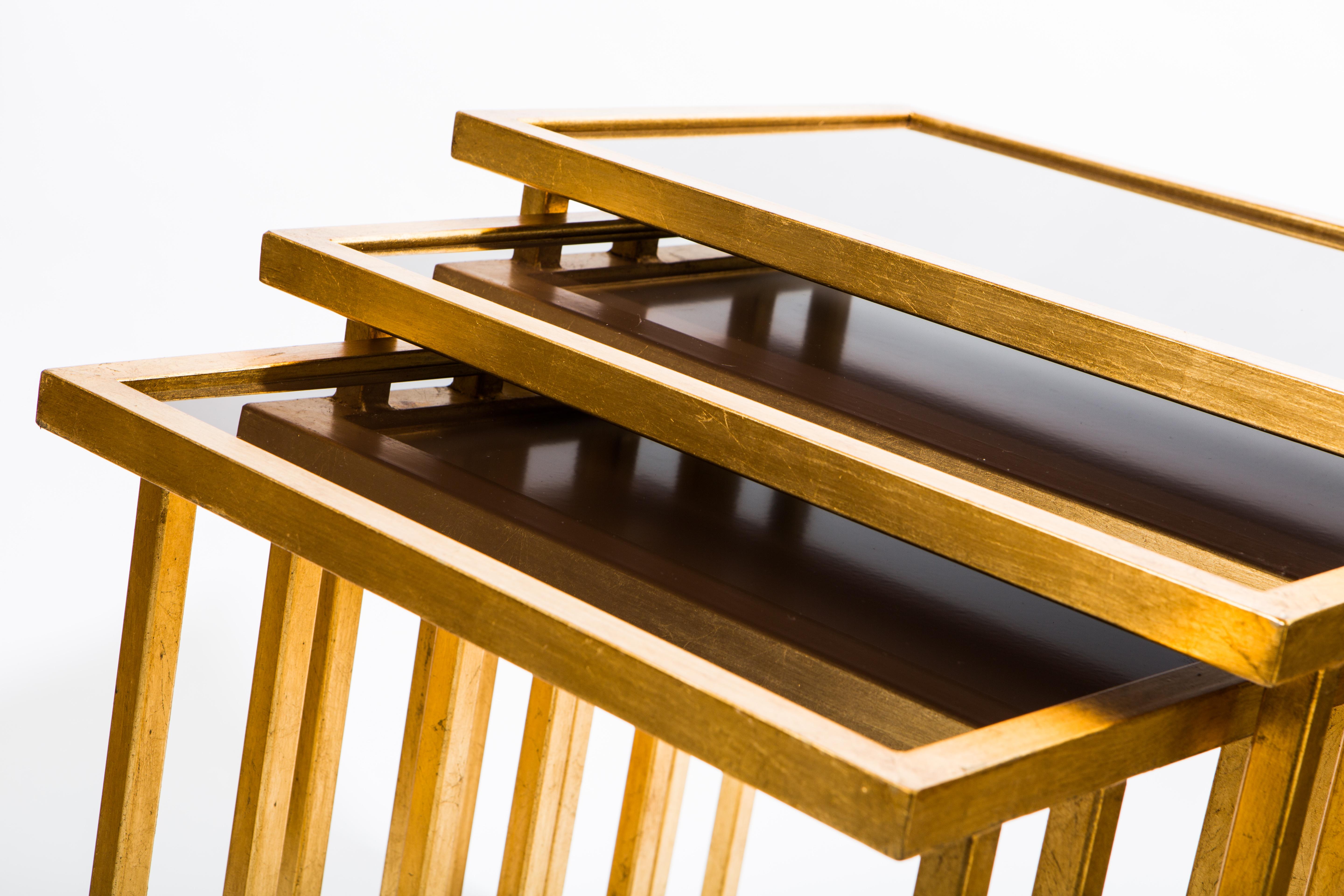 Contemporary Unique Wrought Iron Nesting Tables in 24 Ct Gold Leaf with Bronze Glass Tops For Sale