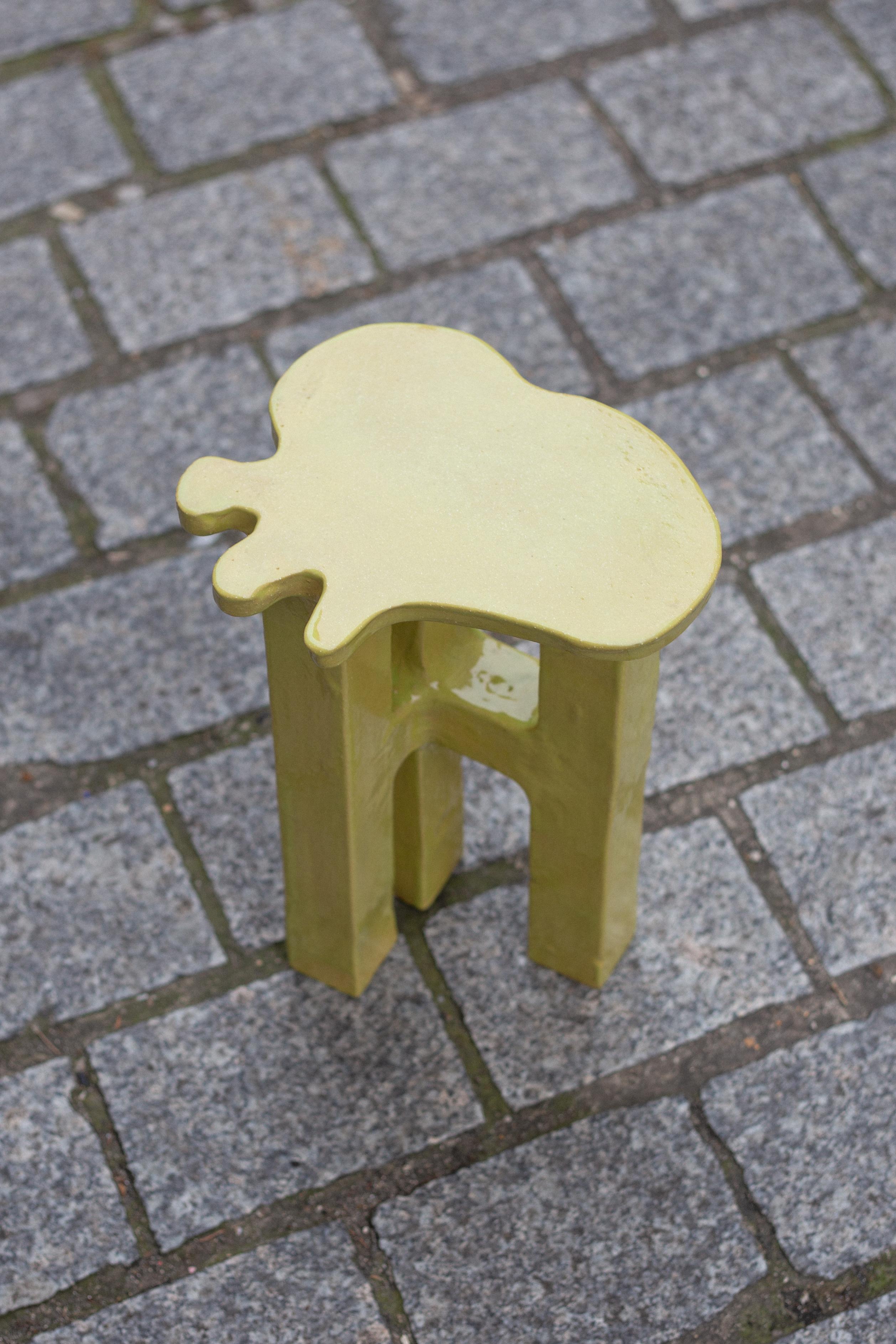 Unique yellow stoneware splash stool by Mesut Öztürk.
Dimensions:  W 24 x D 22 x  H 40 cm.
Materials: stoneware.

Splash side tables are the outcomes of the experiments for an aesthetic pursuit on coupling of contradictions: Minimal designs with
