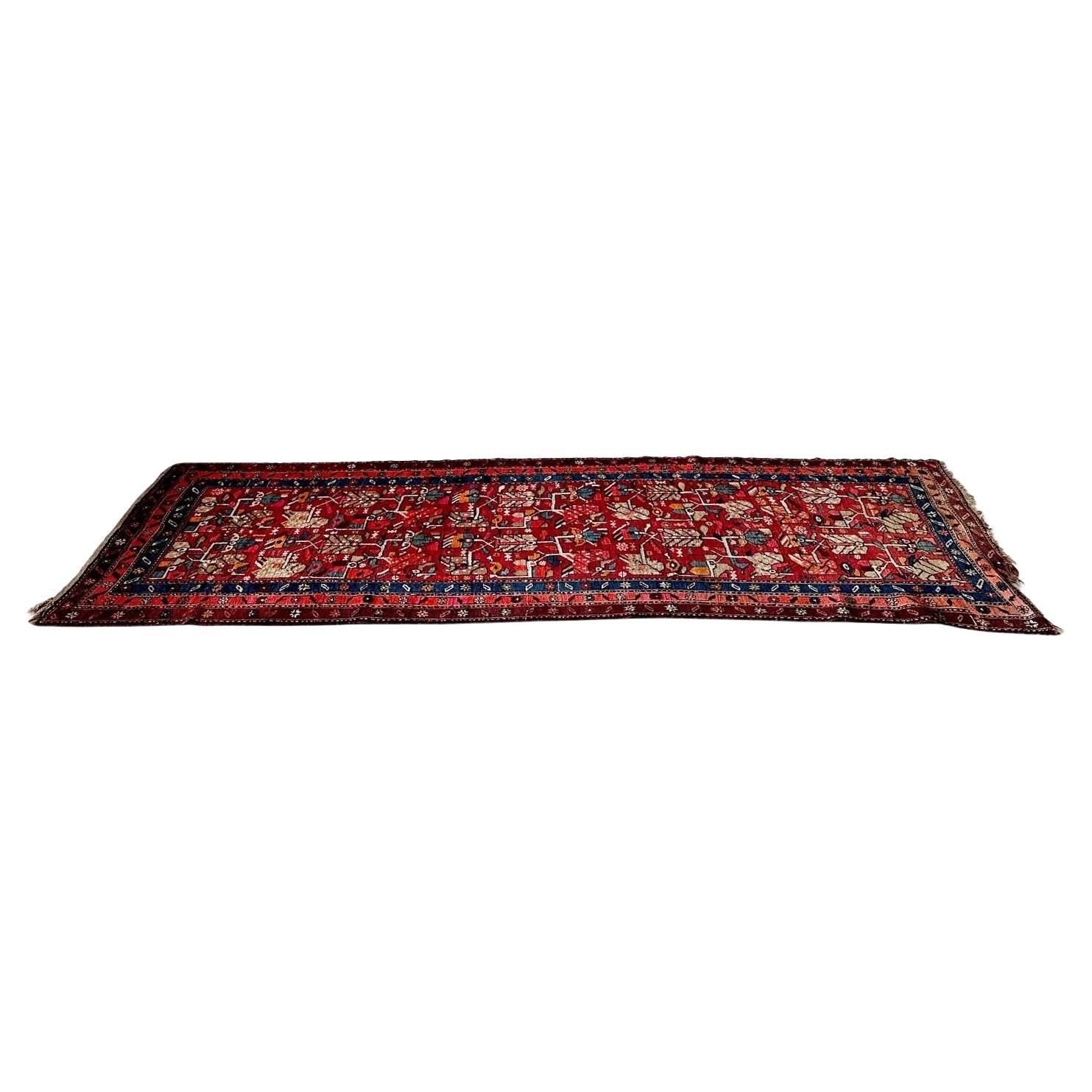 Uniquely shaped vintage hand knotted Turkish rug with low pile For Sale