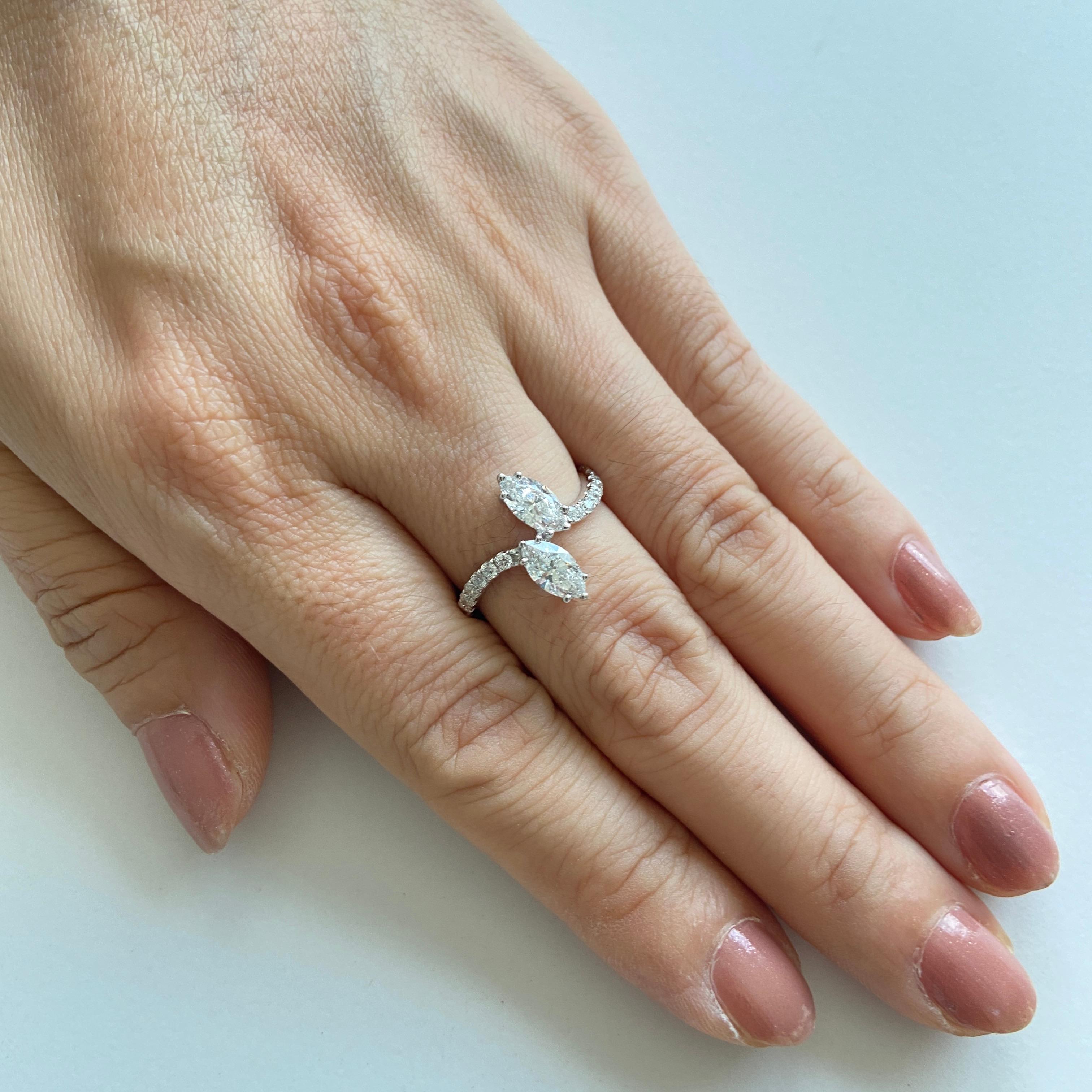 Uniquely styled Ring with certified marquise shaped Natural white diamonds surrounded with round brilliant cut white diamonds made in Platinum

- Marquise White Diamond- 0.81 CT (CGL Certified)
- Round brilliant-cut White Diamond- 0.31 CT


HYT