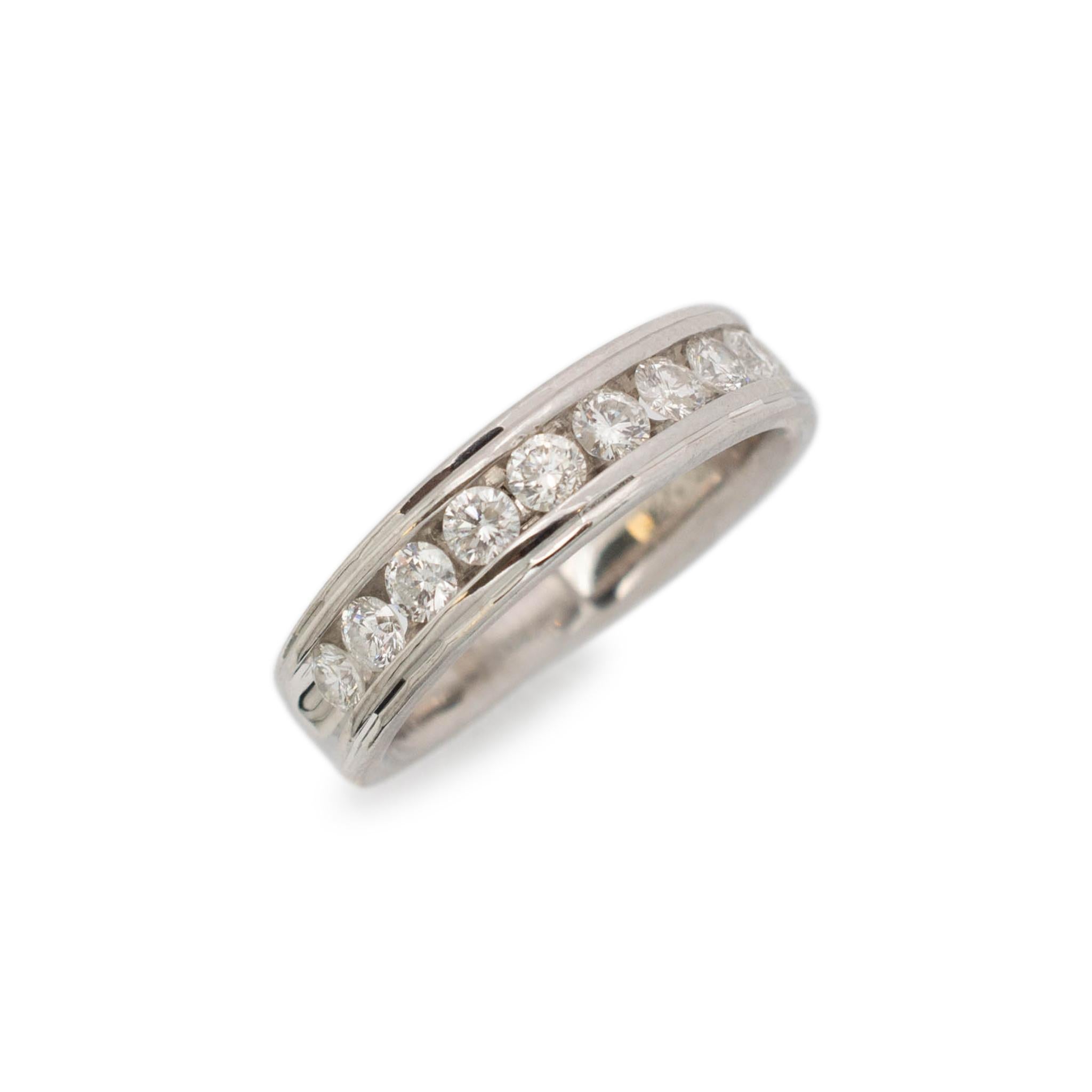Gender: Unisex

Material: 14K White Gold

Size: 9

Shank Width: 5.85 mm

Weight: 7.15 Grams

14K white gold ten-across diamond wedding band with a half-round shank. Engraved with 
