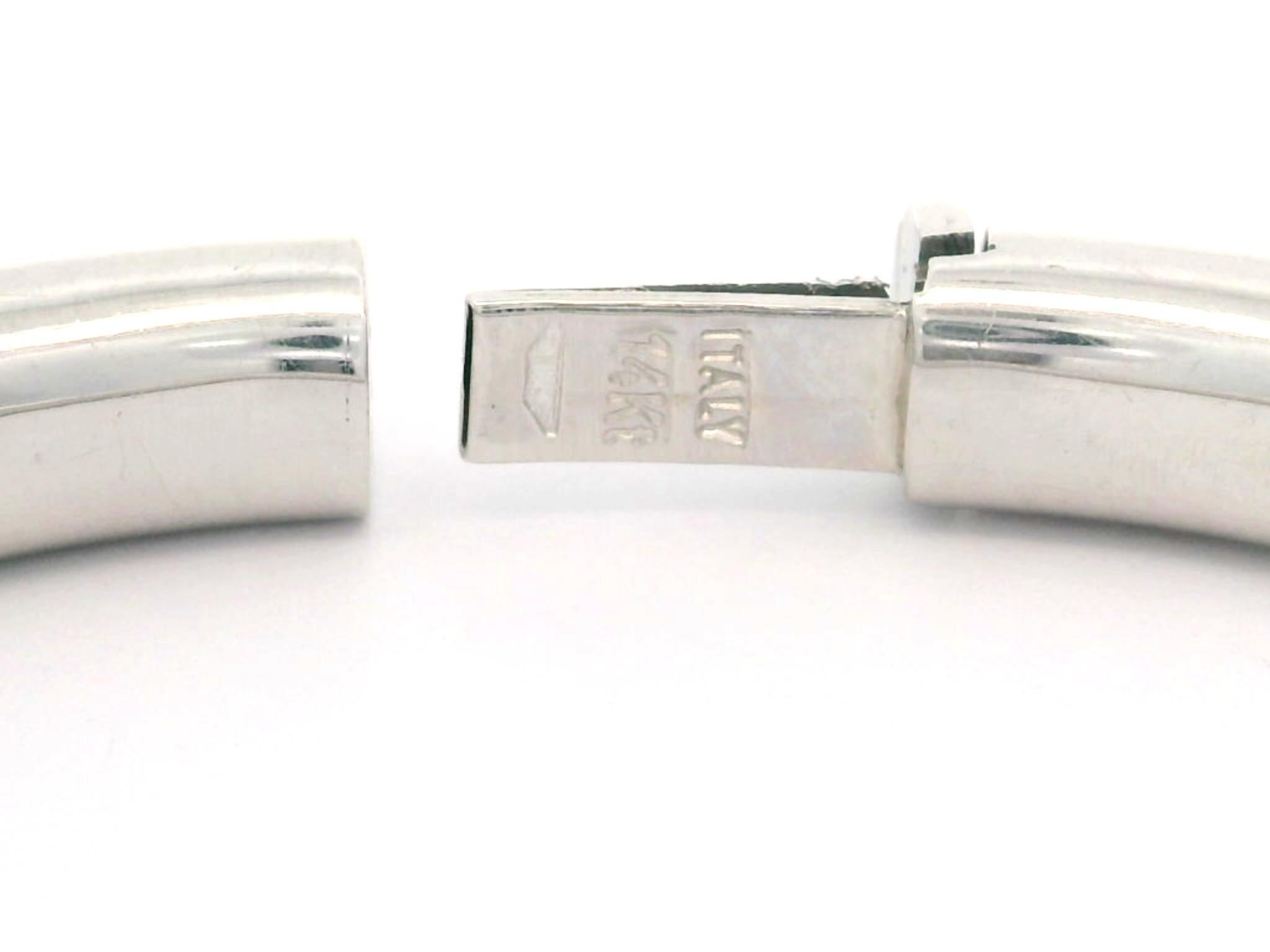 Material: Solid 14k White Gold - Hollow Design
Weight: 16.26 Grams
Type: Hinged bangle
Overall Length: Will Comfortably Fit up to 7.0” (measured on wrist)
Overall Width: 60.48mm (2.38