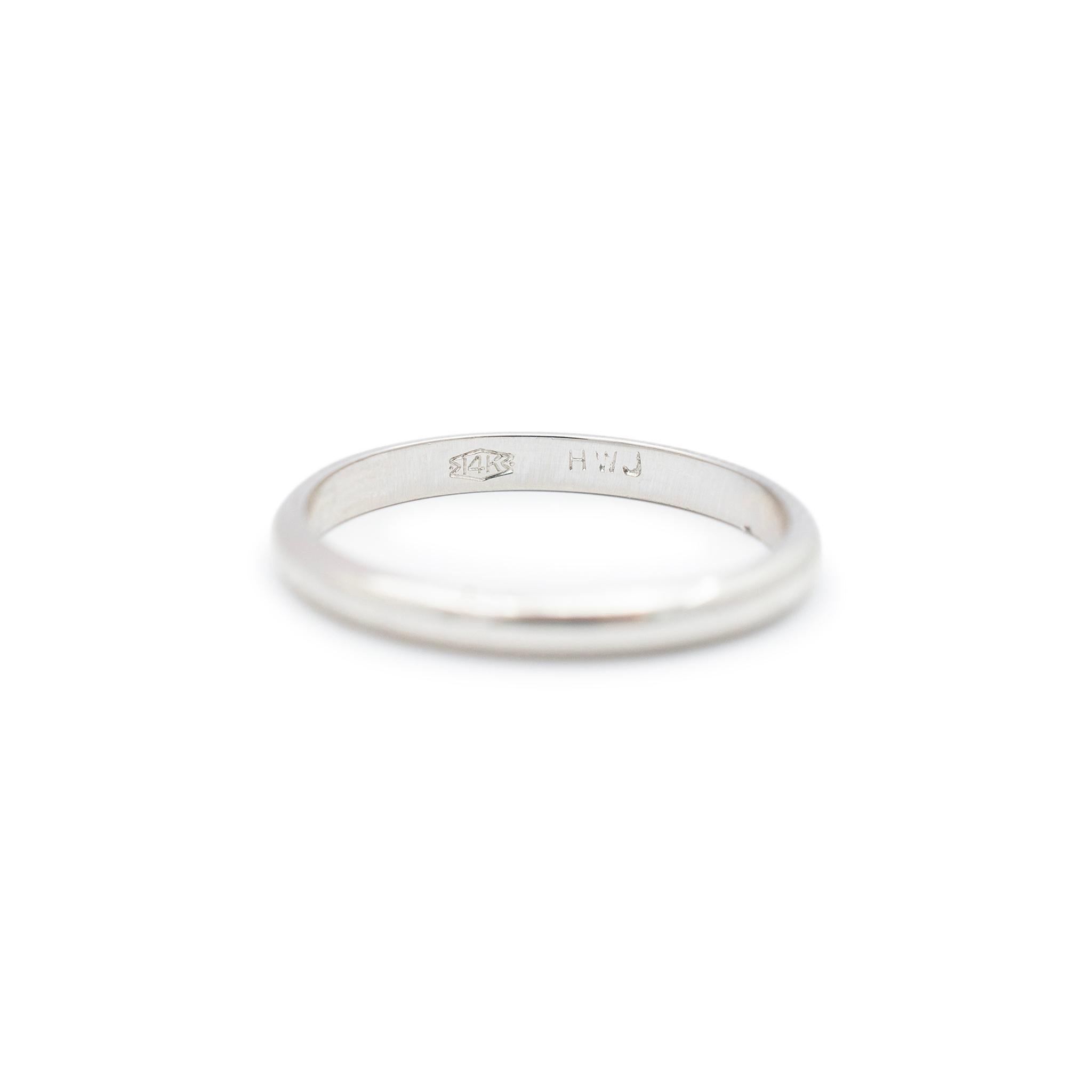 Gender: Unisex

Metal Type: 14K White Gold

Size: 7

Shank Width: 2.40 mm

Weight: 2.00 grams

14K white gold wedding band with a half-round shank. Engraved with 