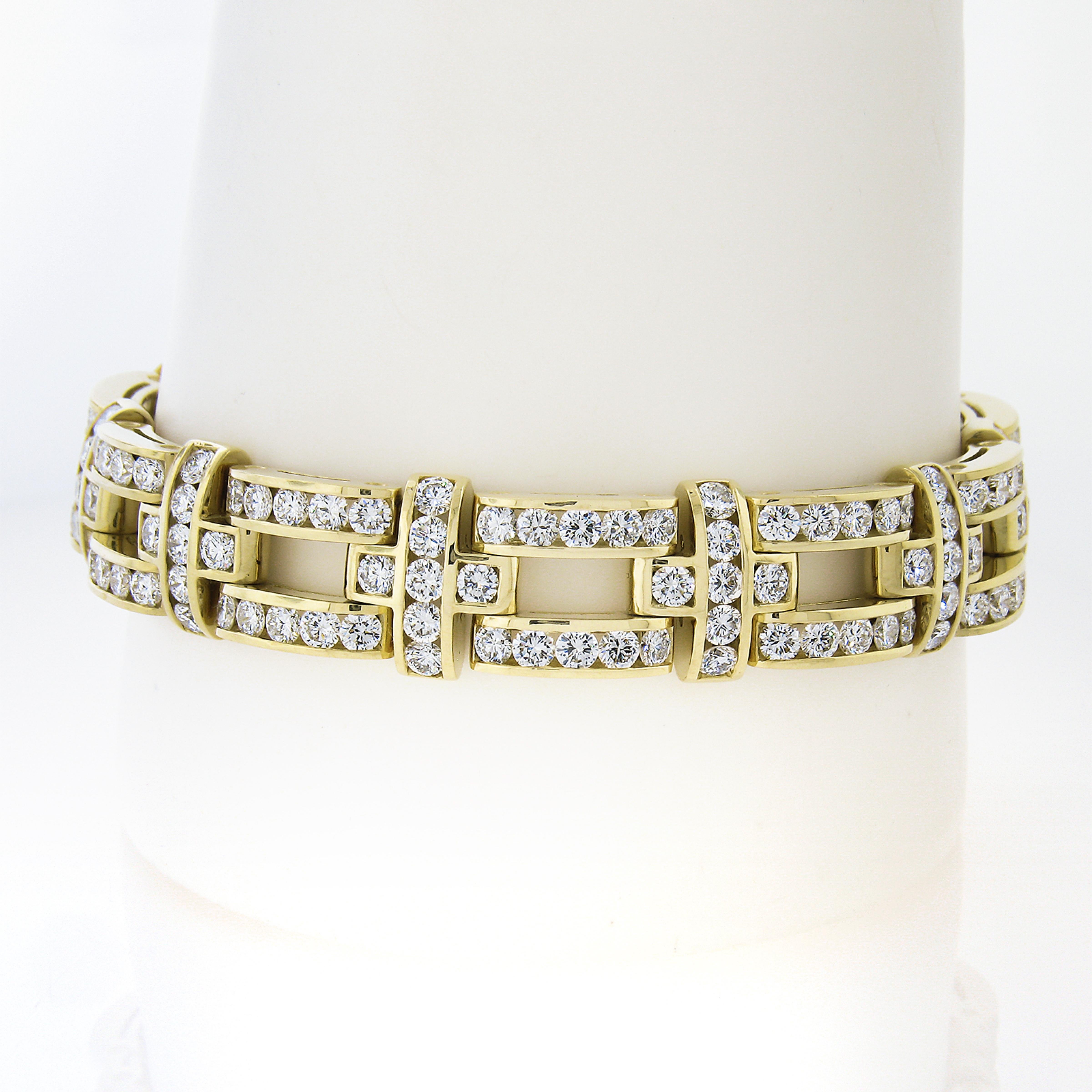 Here we have a truly jaw dropping diamond drenched link statement bracelet that is crafted from solid 18k yellow gold. This very well made bracelet is structured from wide open links that are perfectly channel set with approximately 14.9 carats of