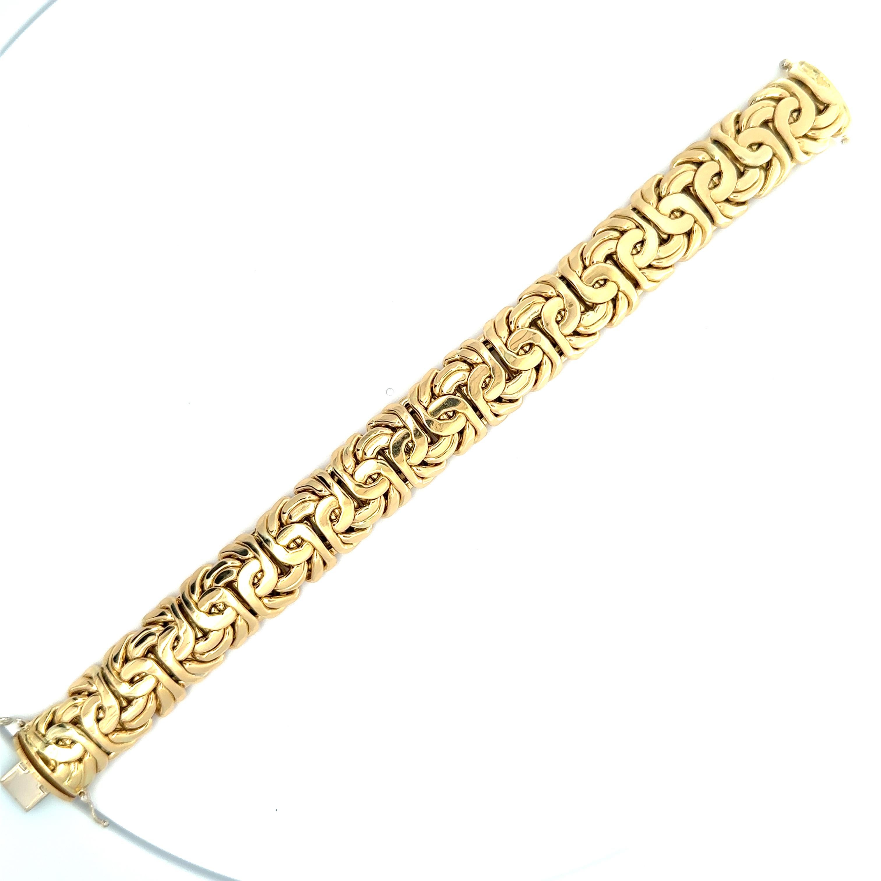 Material: Solid 18k Yellow Gold
Weight: 61.19 Grams
Chain Type: 6.6mm Byzantine Polished Link
Bracelet Length: Will comfortably fit up to a 7.5 inch wrist (fitted on a wrist)
Chain Width: 17.1mm (0.67