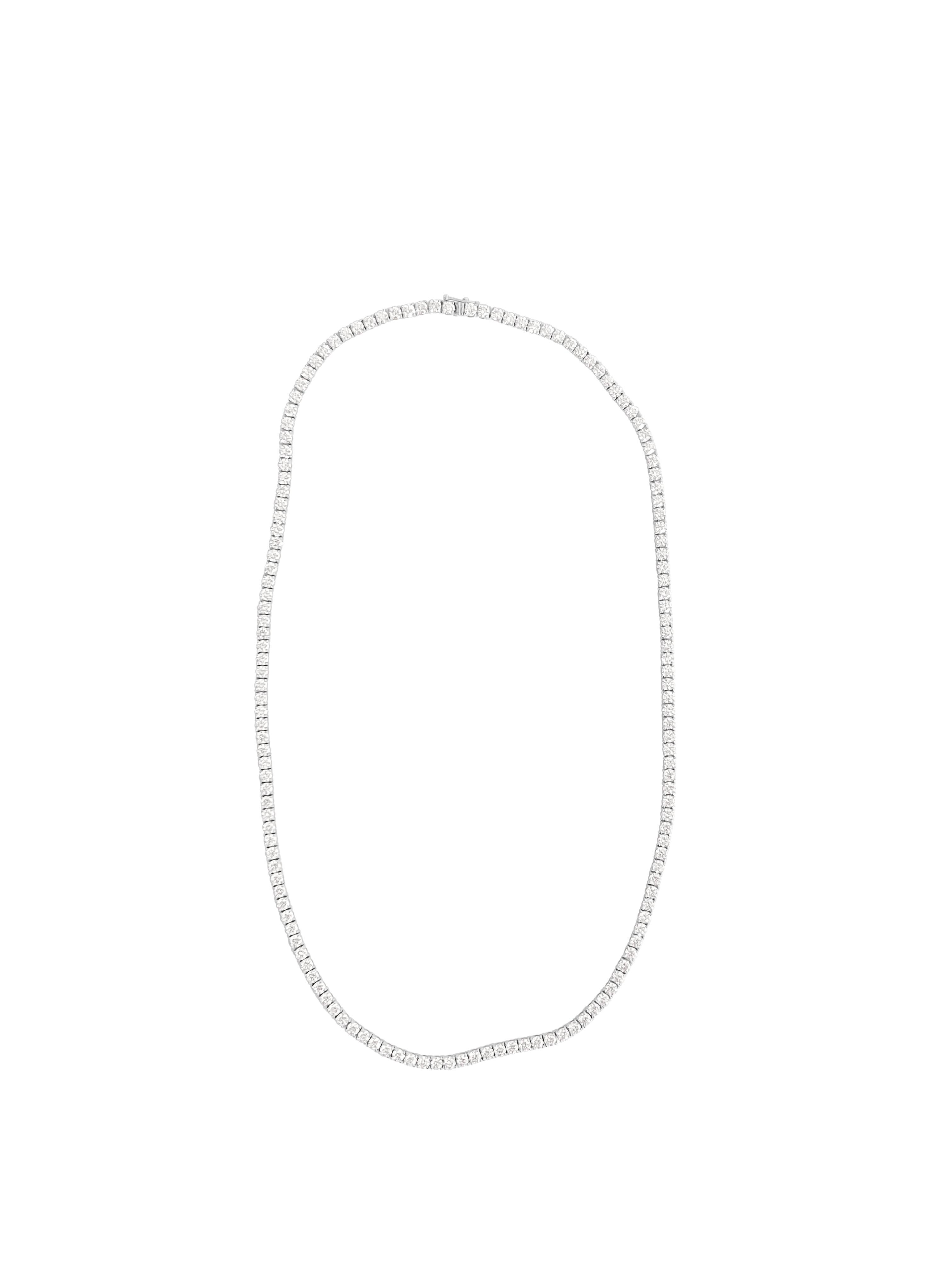 Metal: 14K white gold
Diamonds: 28.50 carat weight total. 
Cut: Round brilliant
Clarity: VVS
Length: 22.50 inches

Brand new custom made diamond tennis necklace in white gold. 
Unisex tennis necklace.

