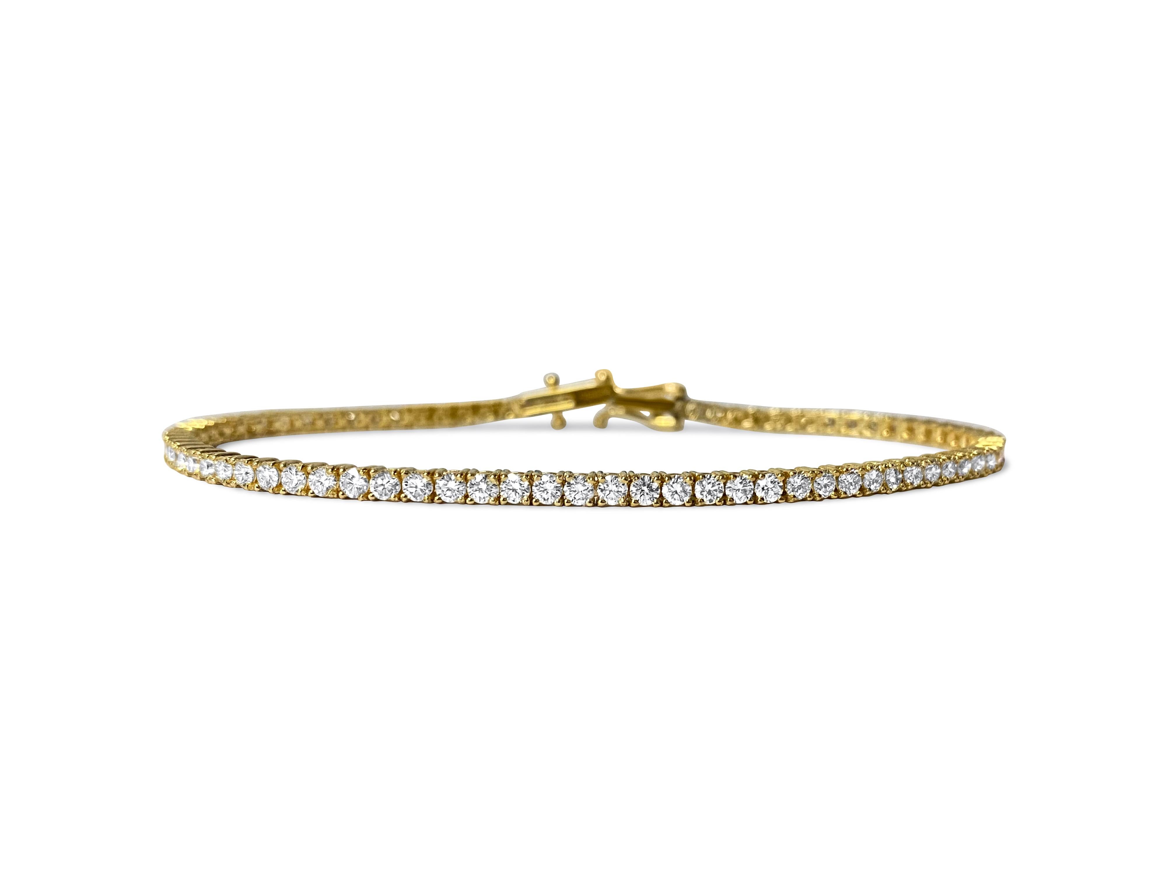 Presenting a spectacular diamond tennis bracelet crafted in 14k yellow gold, adorned with a total of 3.08 carats of exquisite diamonds. With VVS-VS clarity and H color, these round brilliant cut diamonds sparkle brilliantly, set securely in prongs