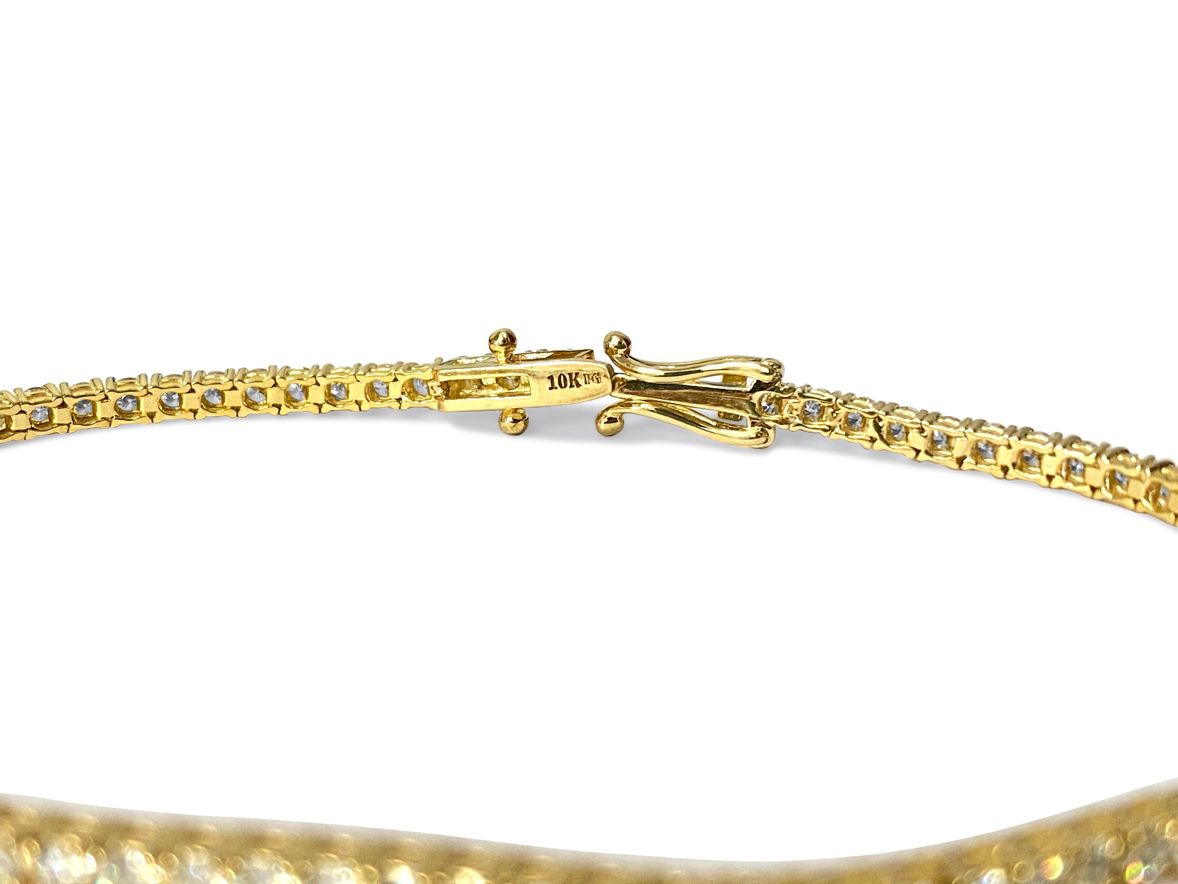 A stunning diamond tennis bracelet meticulously crafted in 14k yellow gold, featuring an impressive total of 4.00 carats of dazzling diamonds. With VVS-VS clarity and H color, these round brilliant cut diamonds are expertly set in prongs, ensuring