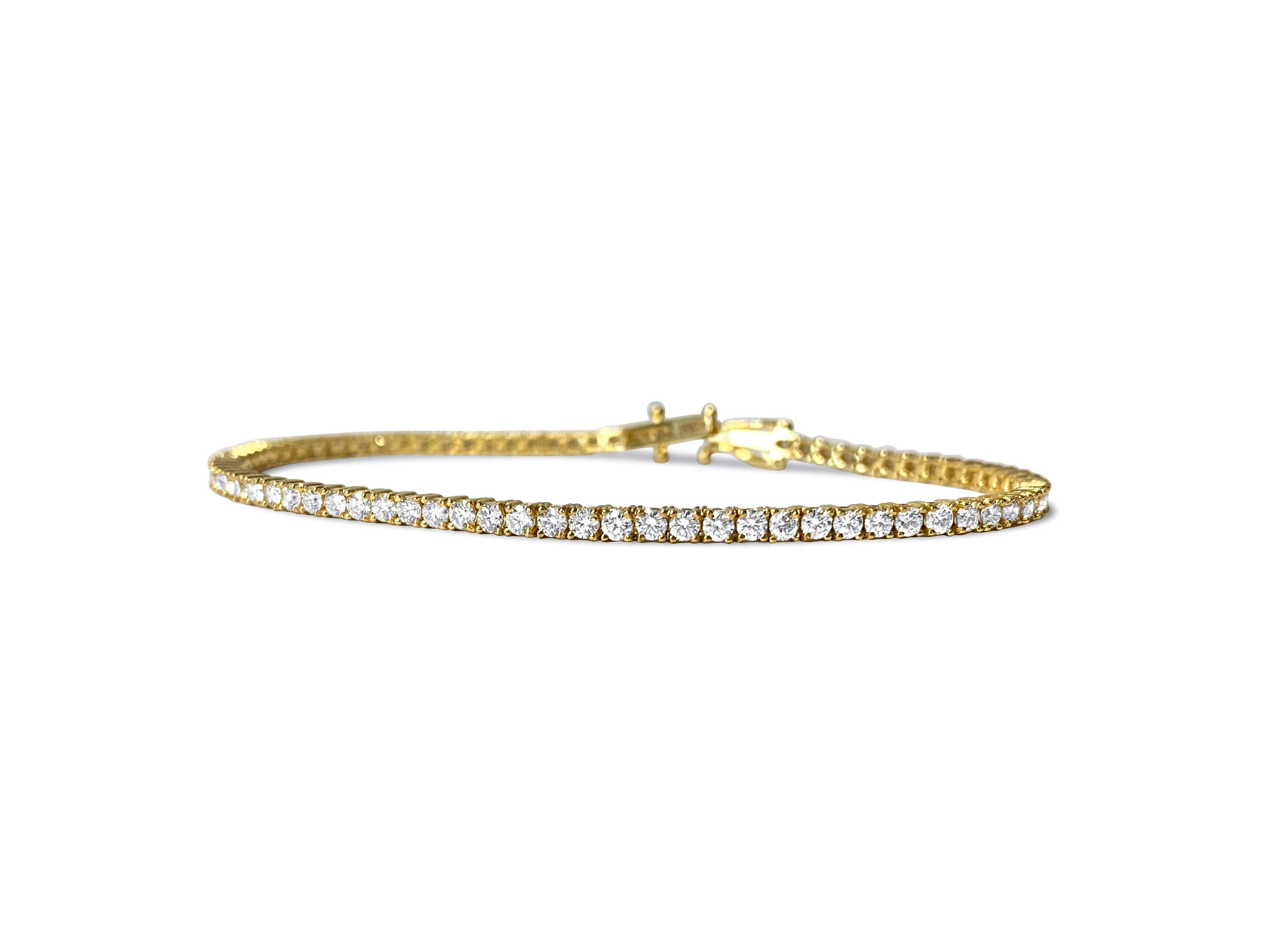 A stunning diamond tennis bracelet meticulously crafted in 14k yellow gold, featuring an impressive total of 4.00 carats of dazzling diamonds. With VVS-VS clarity and H color, these round brilliant cut diamonds are expertly set in prongs, ensuring