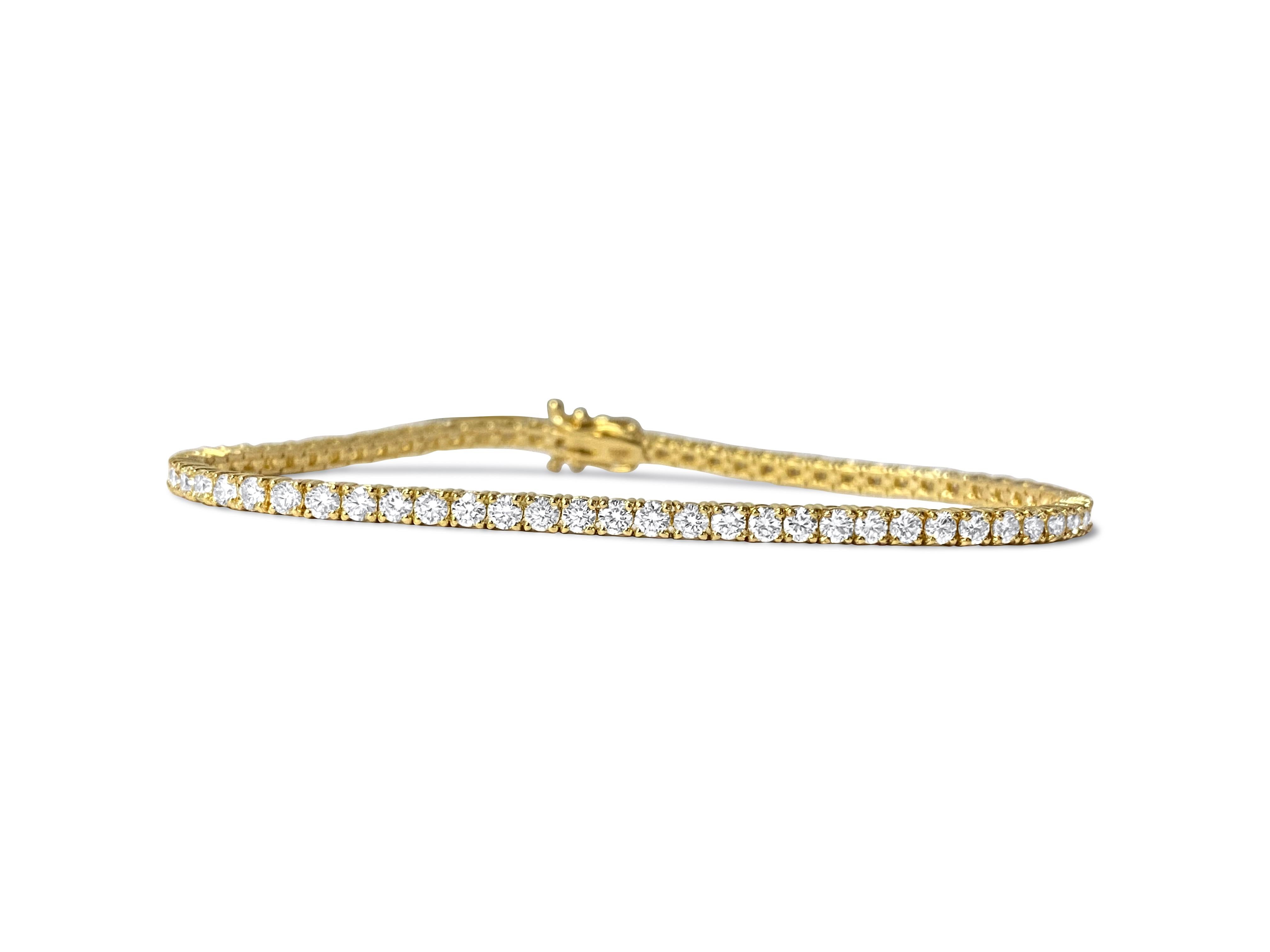 Crafted from luxurious 14k yellow gold, this exquisite unisex diamond tennis bracelet boasts a total carat weight of 5.00, featuring diamonds with VVS-VS clarity and H color. Set in prongs, each round brilliant cut diamond sparkles with unparalleled