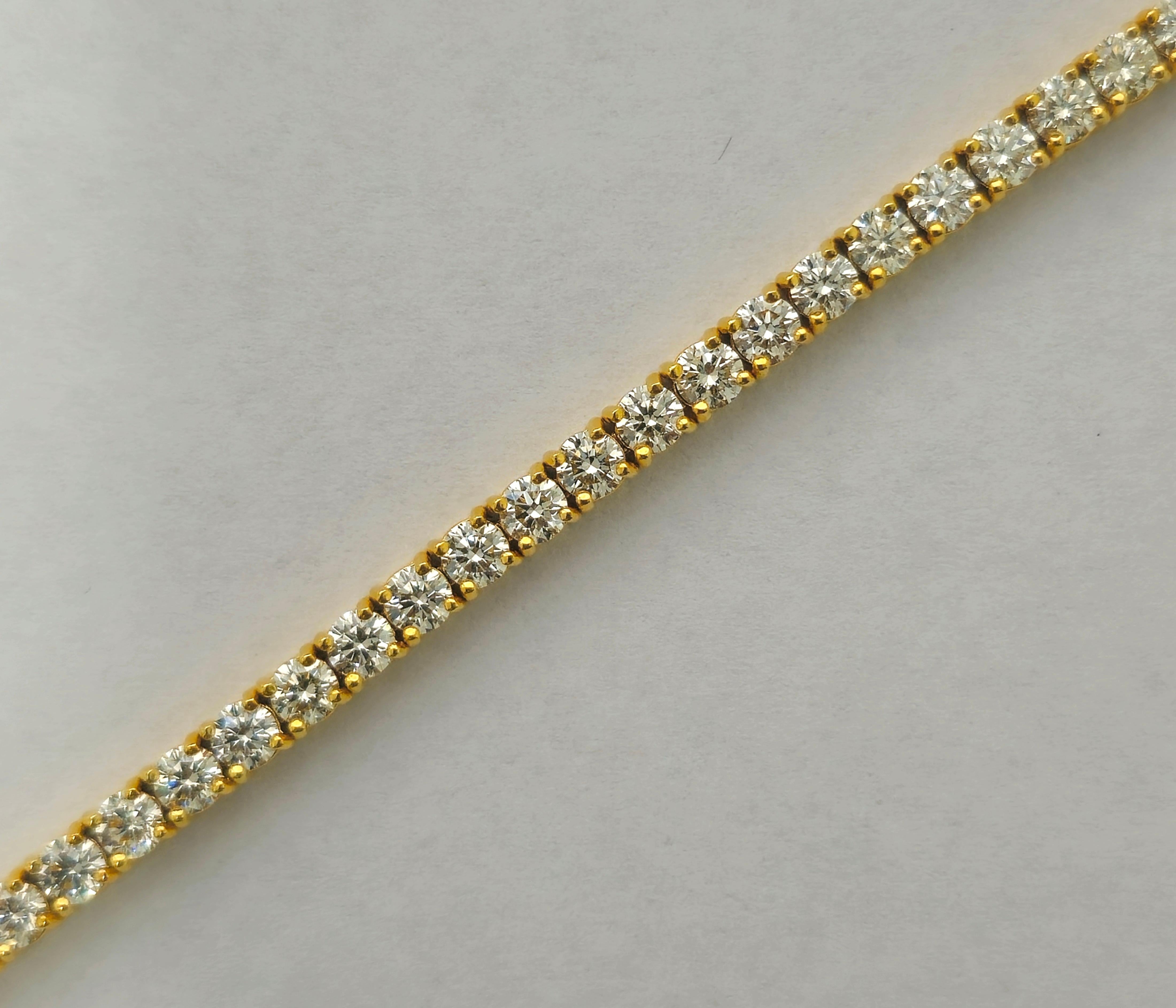 Indulge in luxury with our Unisex Tennis Bracelet, a radiant symbol of sophistication. Crafted from exquisite yellow gold and adorned with a dazzling array of round brilliant cut diamonds, each boasting exceptional clarity, this bracelet exudes