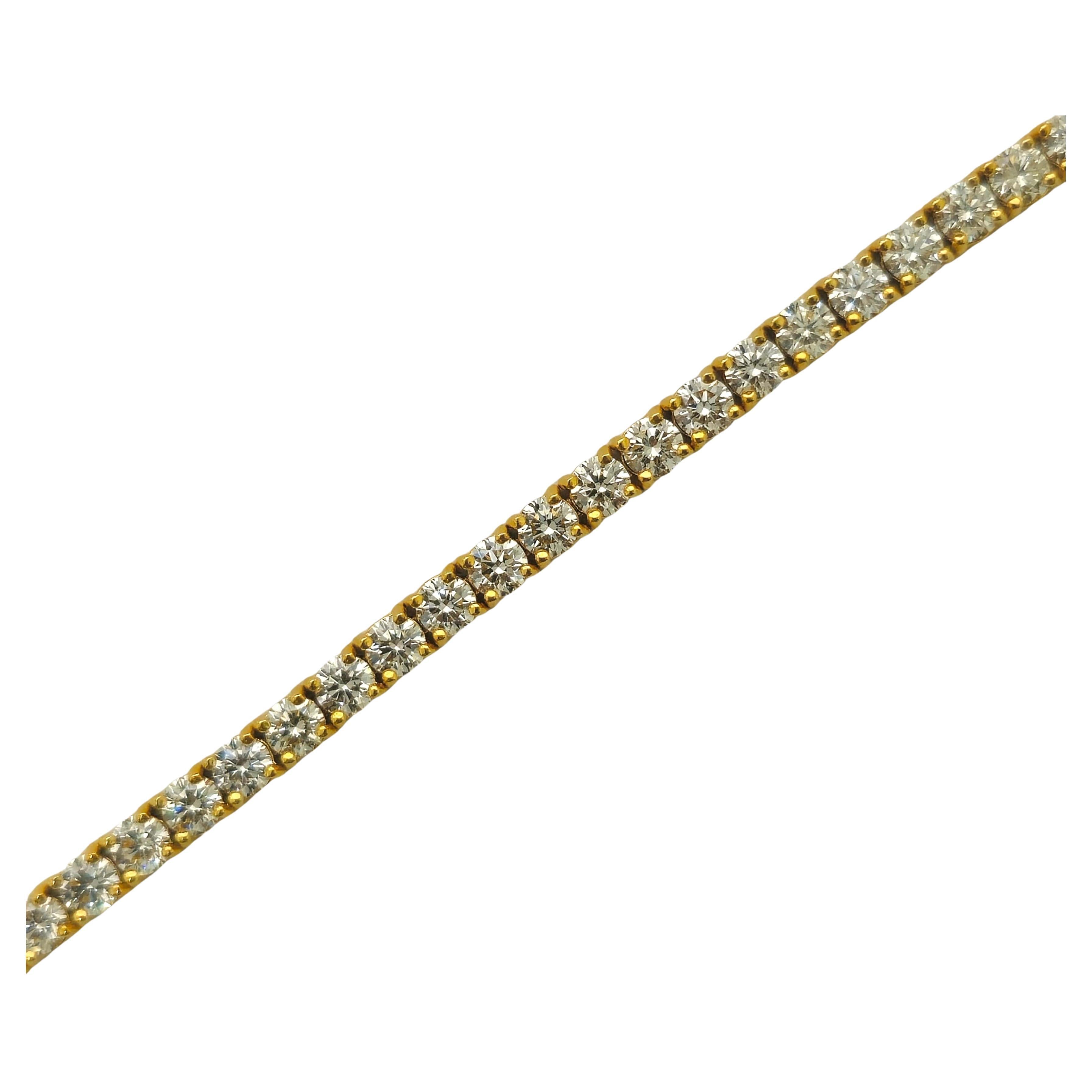 Indulge in luxury with our Unisex Tennis Bracelet, a radiant symbol of sophistication. Crafted from exquisite yellow gold and adorned with a dazzling array of round brilliant cut diamonds, each boasting exceptional clarity, this bracelet exudes