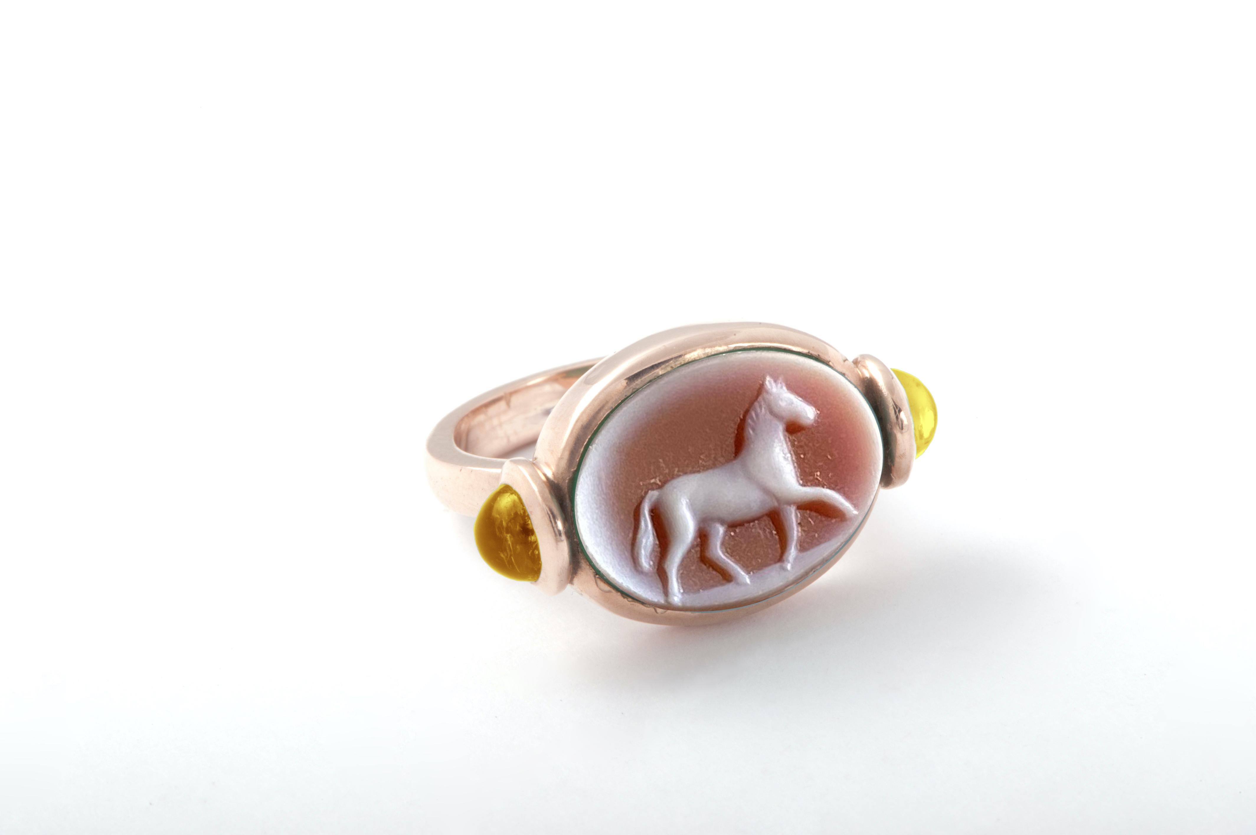 Rossella Ugolini Design Collection a perfectly hand carved Carnelian ring  Handcrafted in yellow gold embellish with two yellow Citrine cabochon cut .  A Unisex Unique Design Signet Ring  for a Horse Lovers. The horse is a solar animal. Due to its