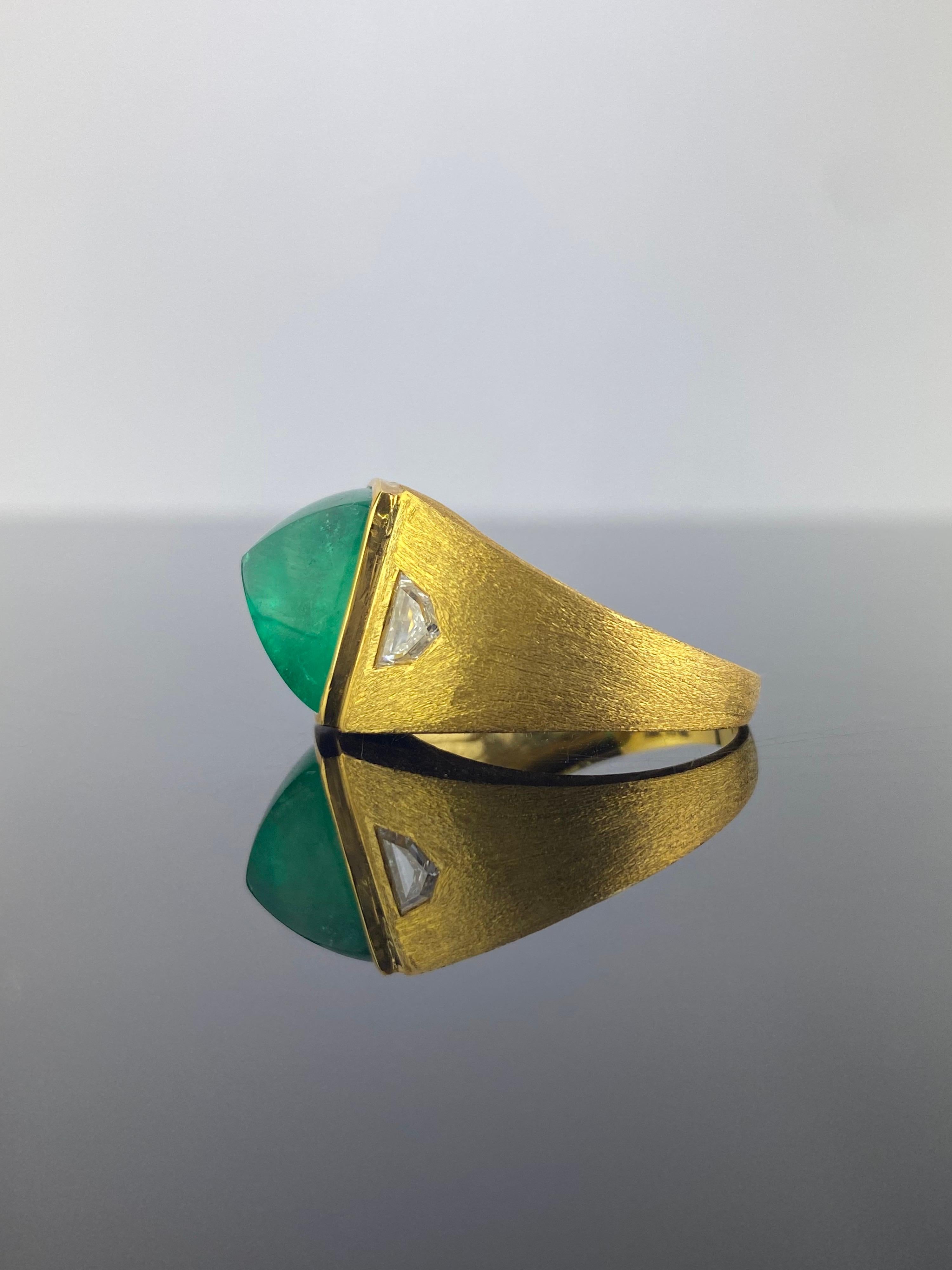 A stunning, antique style, 8.75 carat sugarloaf Colombian Emerald and 0.61 carat Cadillac shaped Diamond signet ring, currently sized at US 7, but can be altered. The stones are set in solid 18K Yellow Gold. 
We provide free shipping. Returns