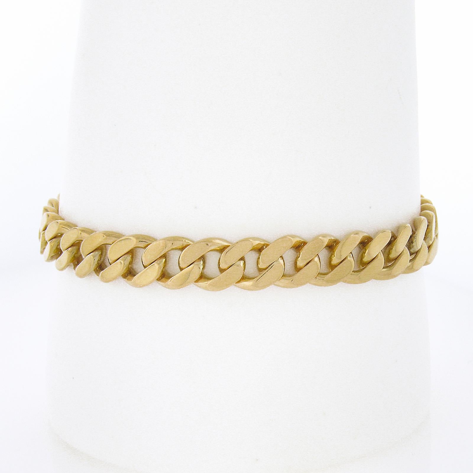 Material: Solid 18k Yellow Gold 
Weight: 29.41 Grams
Chain Type: Flat Curb/Cuban Link
Chain Length:	Will comfortably fit up to a 7.5 inch wrist (fitted on a wrist)
Chain Width: 7.7mm
Chain Thickness: 2.4mm rise off the wrist
Clasp: Box Clasp w/ Side