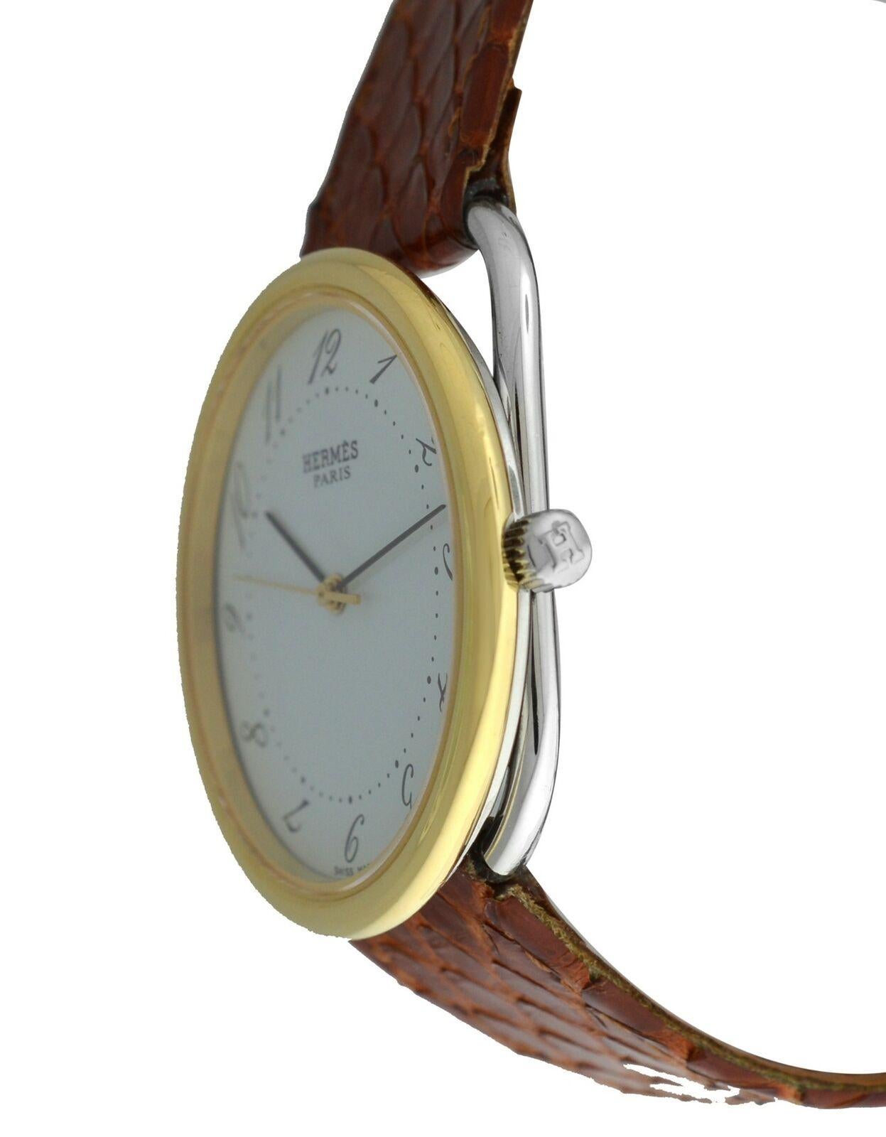 
Marque	Hermès
Modèle	Arceau AR3.720
Genre	Hommes Unisexe
Condit	D'occasion
Mouvement	Quartz suisse
Matériau du boîtier	Steele et or
Matériau du bracelet / de la courroie	
Aftermarket - Véritable serpent

Matériau du fermoir / de la boucle	
Plaqué