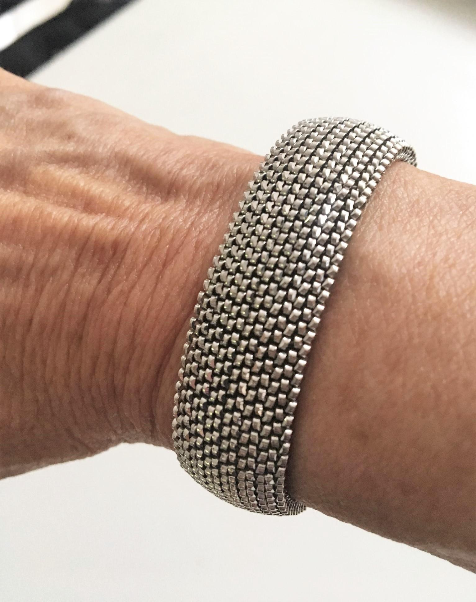 Sleek styling,  with flexible stretch and incredibly comfortable to wear.  This modern style bracelet is made of eighteen karat (18K) white gold flexible mesh.
Unmatched in its versatility, this bracelet has an adjustable fit and measures at and it