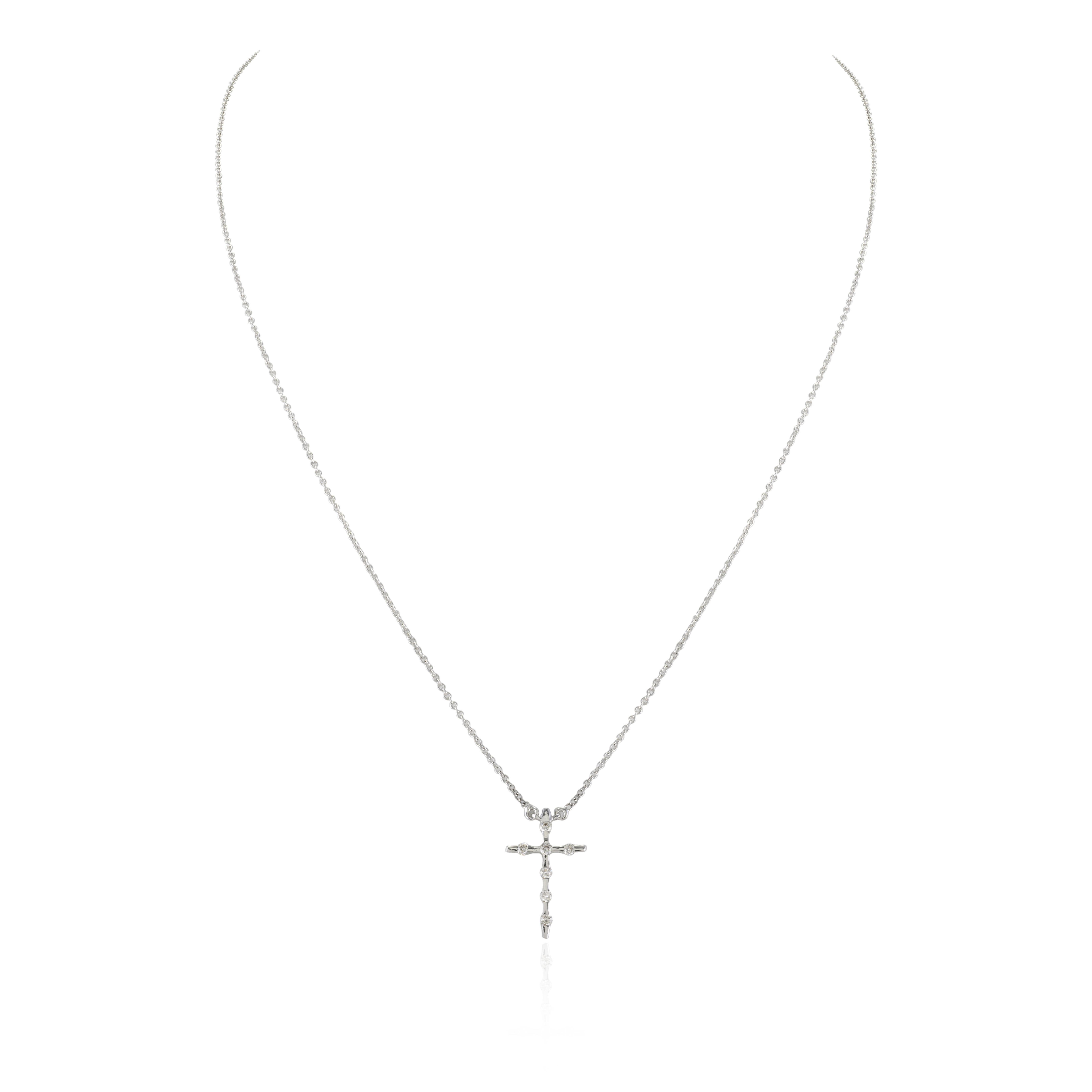 Unisex Diamond Cross Pendant Necklace in 18K Gold studded with round cut diamonds. This stunning piece of jewelry instantly elevates a casual look or dressy outfit. 
April birthstone diamond brings love, fame, success and prosperity.
Designed with