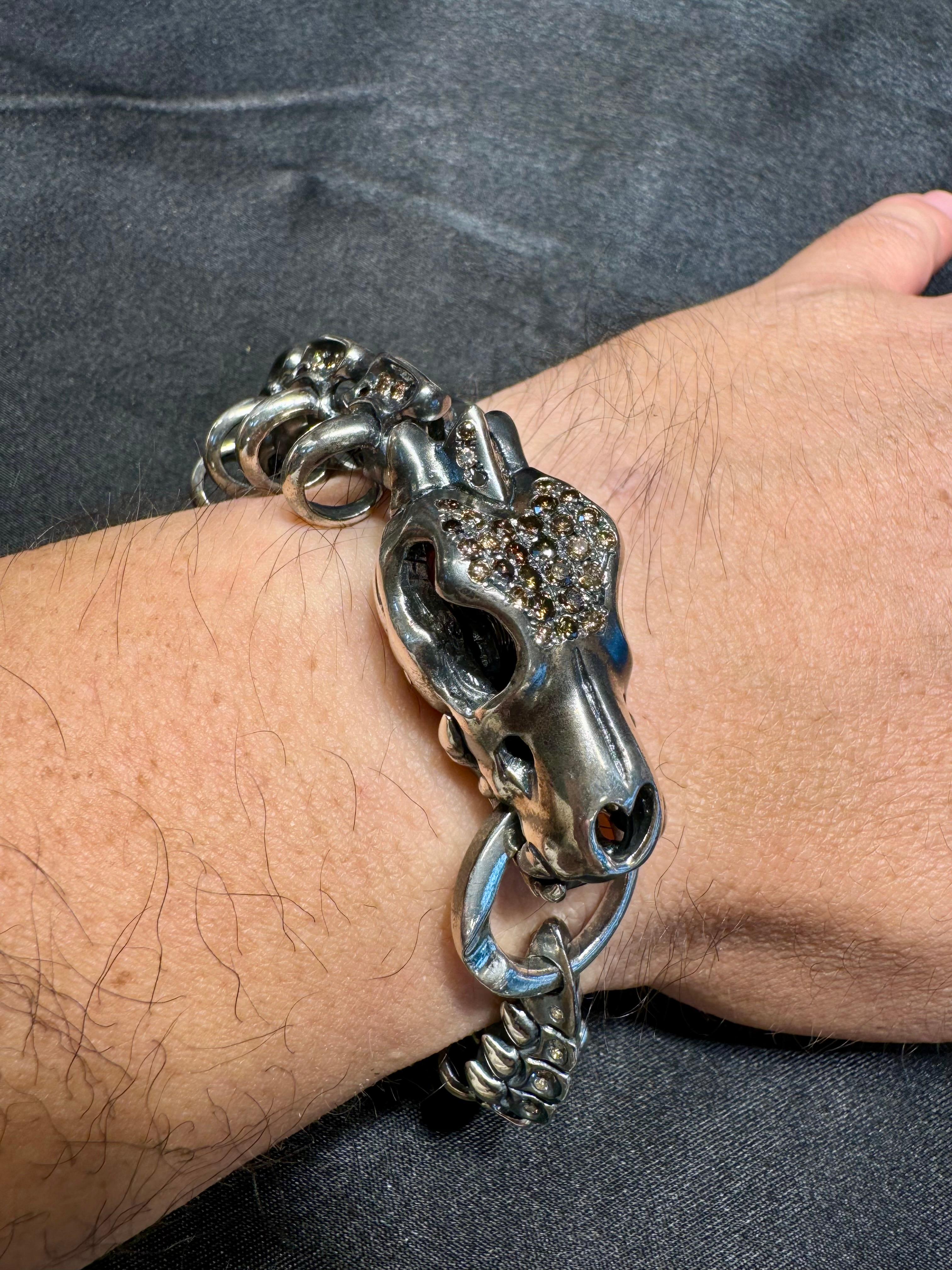 Please check out the HD video! This is a piece unique statement piece! The skeleton dragon bracelet is made up of 925 silver and natural fancy colored diamonds. This bracelet is suitable for man and woman. Not much to really say about this piece