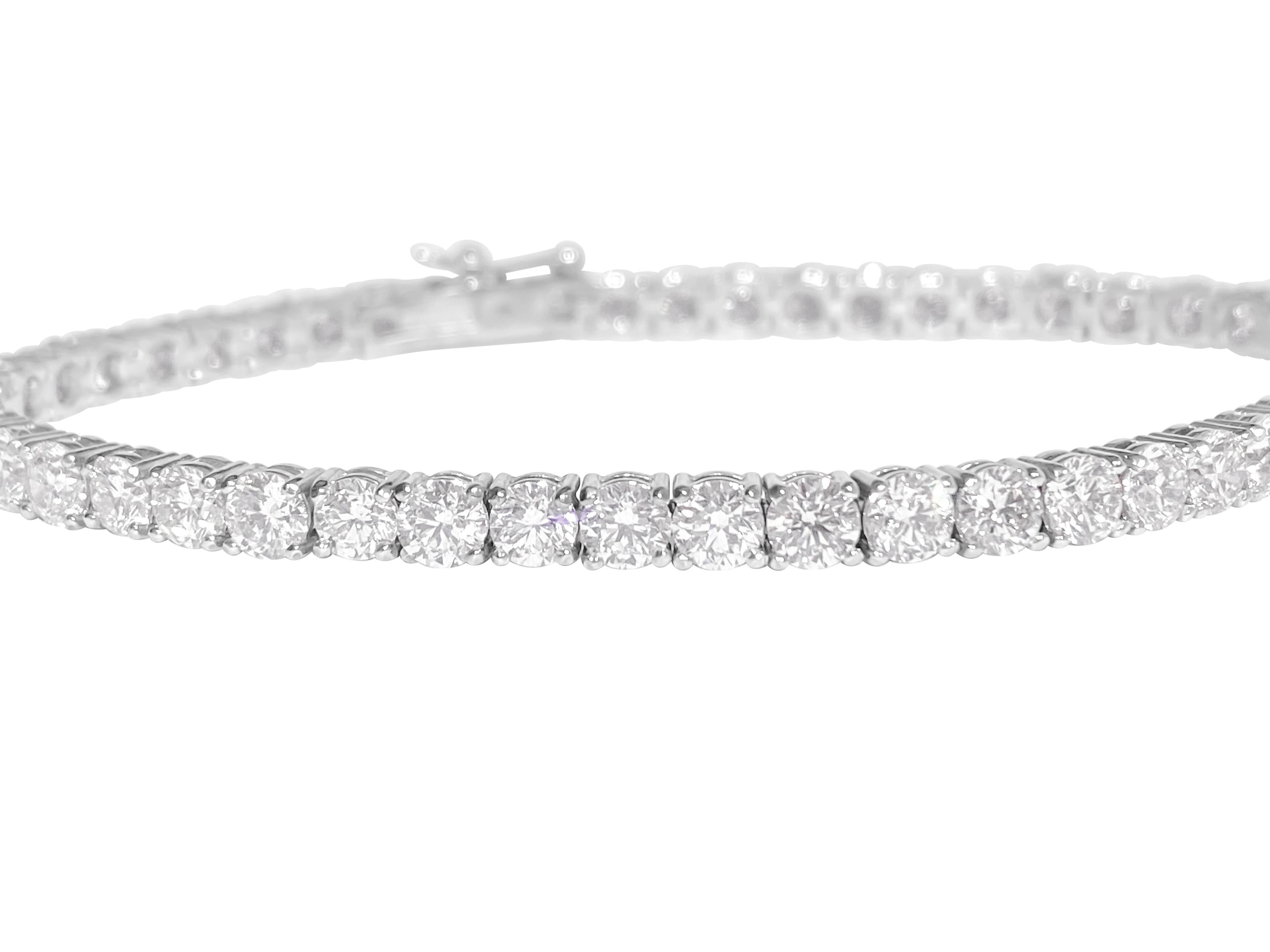 Metal: 14k white gold. 
9.10 carat diamonds total. Round brilliant cut. VVS clarity. 
100% natural earth mined diamonds
20 pointer diamonds.
Setting: prongs
Style: Tennis bracelet.
Tongue hook. 
10.73 grams. 7 inches. 

Brand new custom made tennis