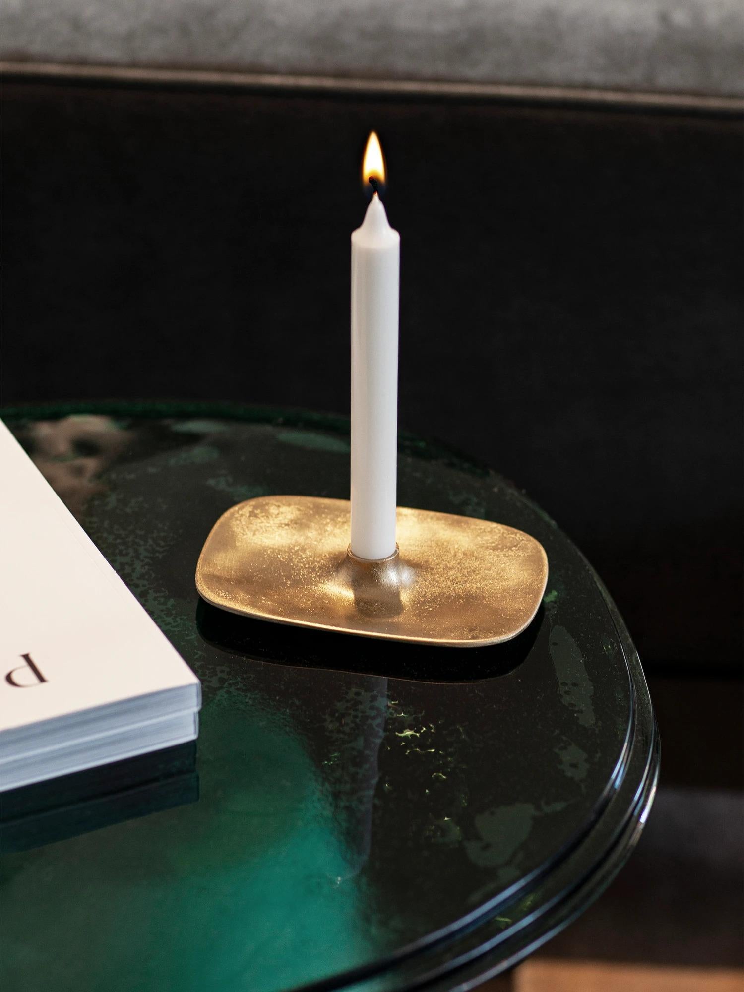 The Fluid Series Candle Holder, crafted using the sand-casting technique, is elegantly designed to host a single candle. Its integrated surrounding tray enhances the organic aesthetic while serving a practical purpose by catching any dripping wax,