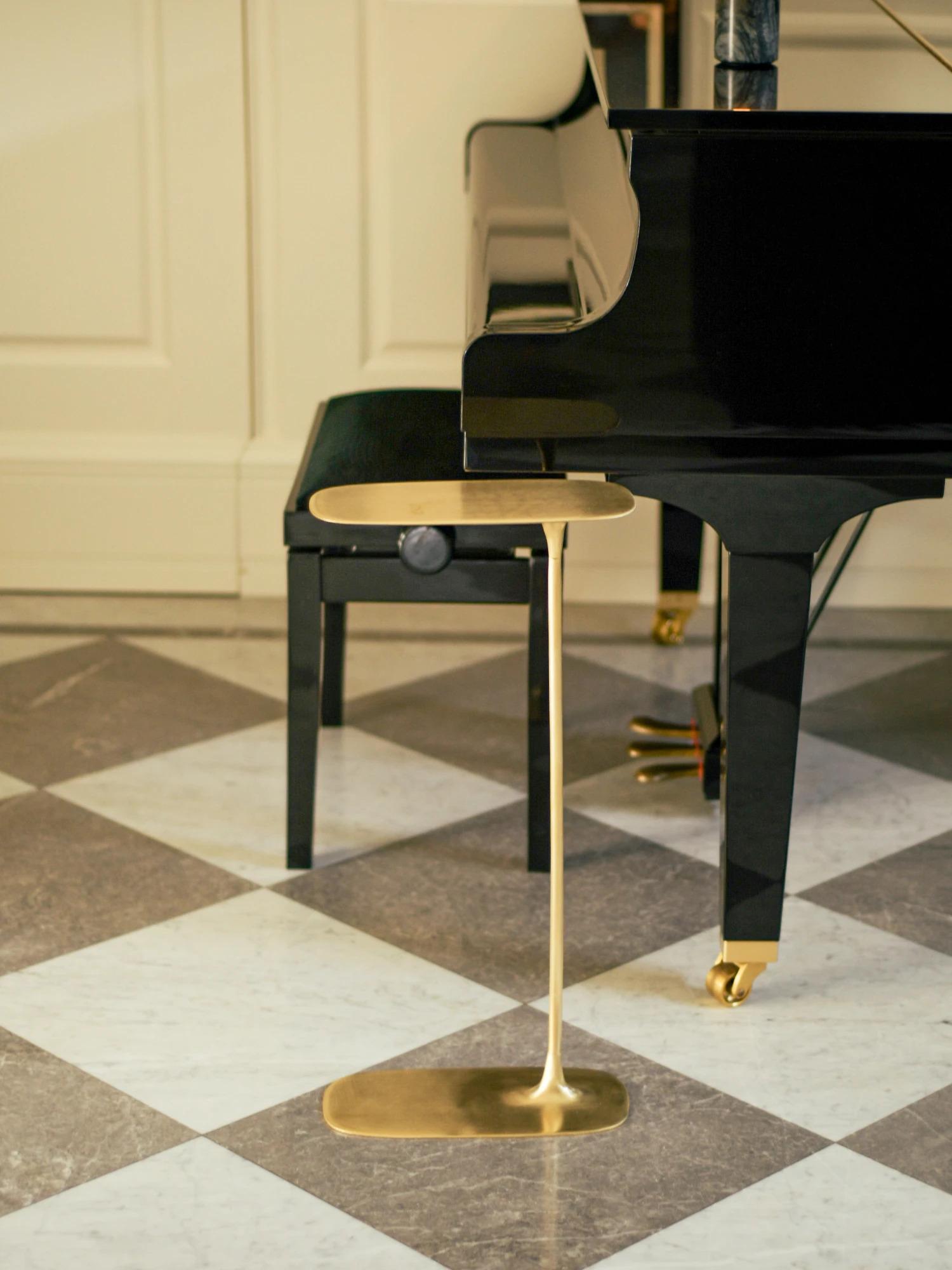 A set of two coffee tables that will perfectly complement the interior of your living room.

The Fluid Side Table, crafted using the sand-casting method and standing 64 cm tall, is designed to slide effortlessly under any sofa or armchair. The table