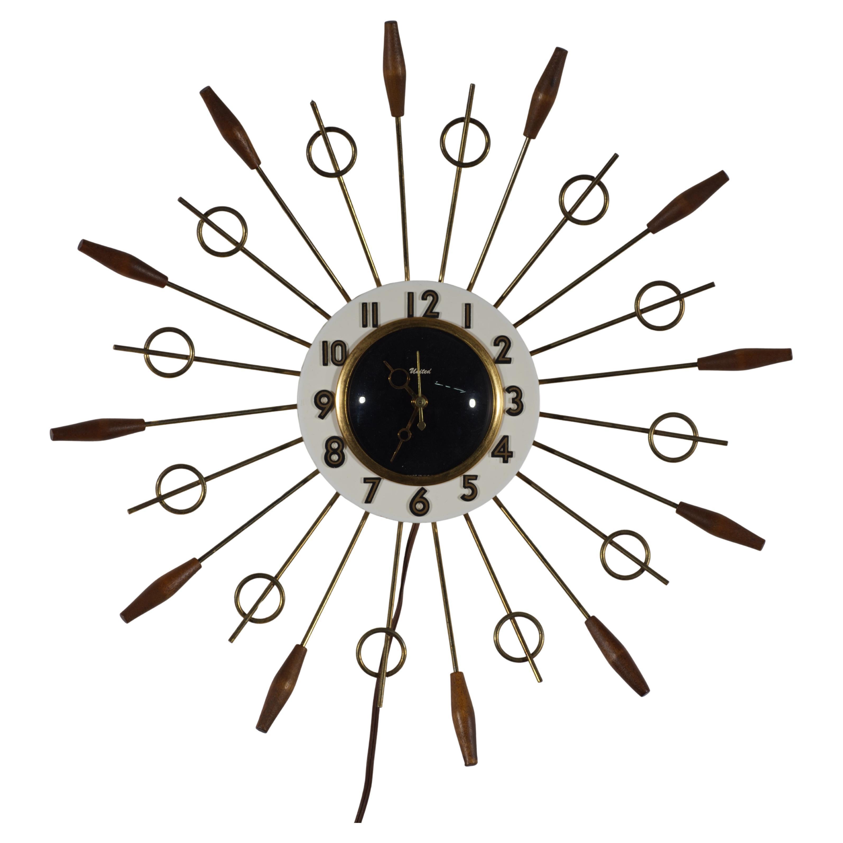 Reloj atómico United Brass Spindles Sunburst, años 60