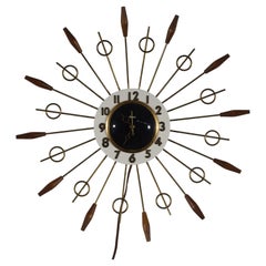 Reloj atómico United Brass Spindles Sunburst, años 60