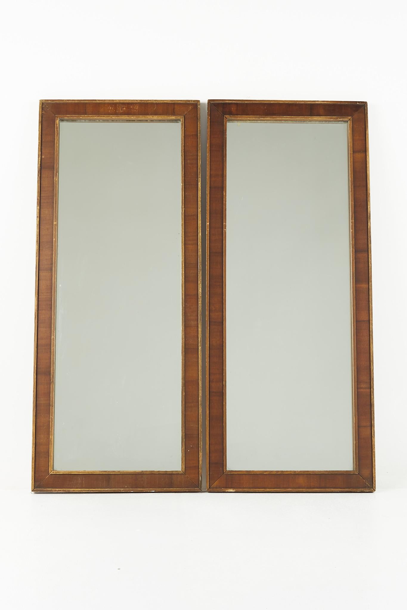 United Brutalist mid century walnut mirrors - pair

Each of these mirrors measure: 20.25 wide x 1.25 deep x 48.5 inches high

All pieces of furniture can be had in what we call restored vintage condition. That means the piece is restored upon