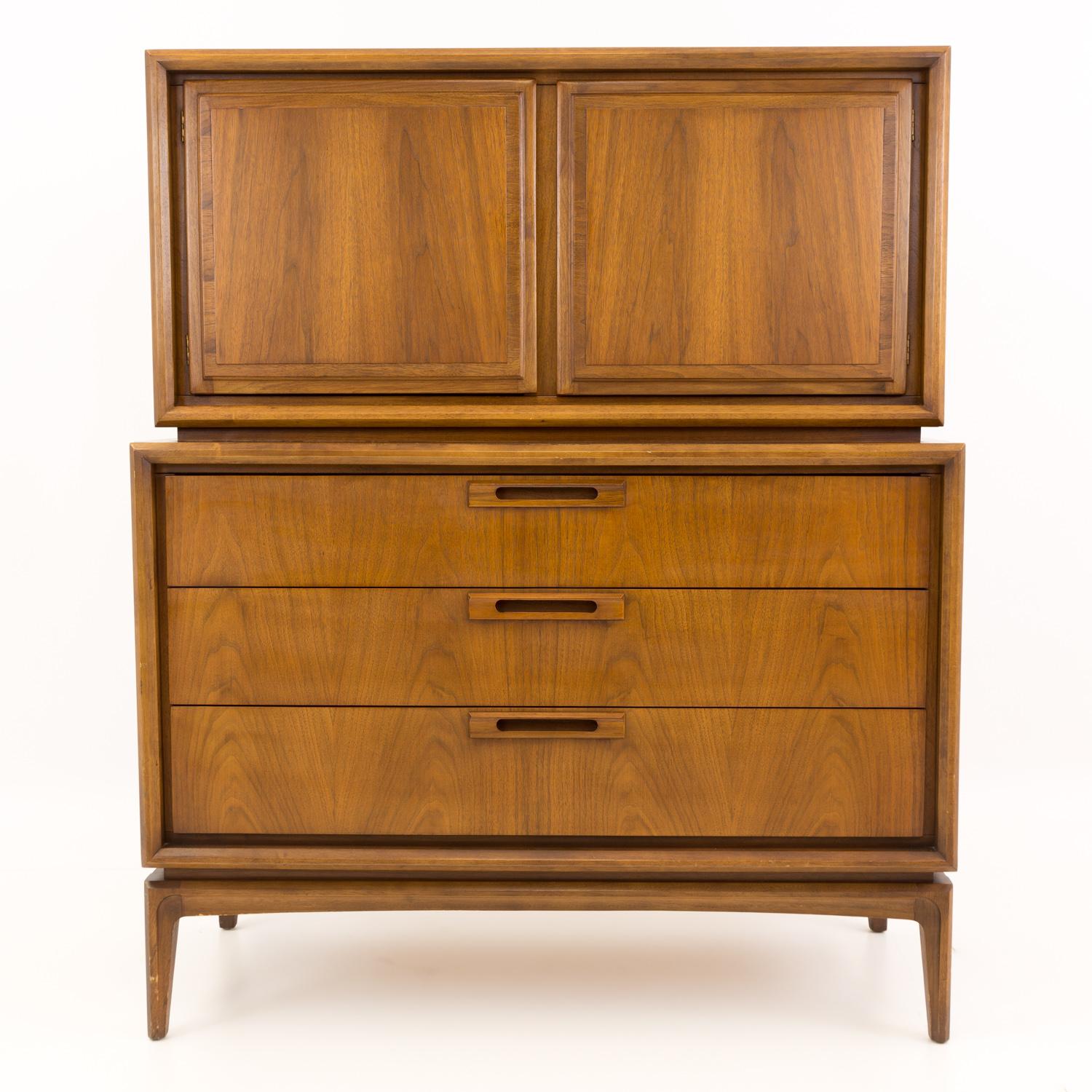 United Furniture Mid Century Walnut Highboy Dresser

This dresser measures: 42 wide x 19 deep x 50.75 inches high

All pieces of furniture can be had in what we call restored vintage condition. That means the piece is restored upon purchase so