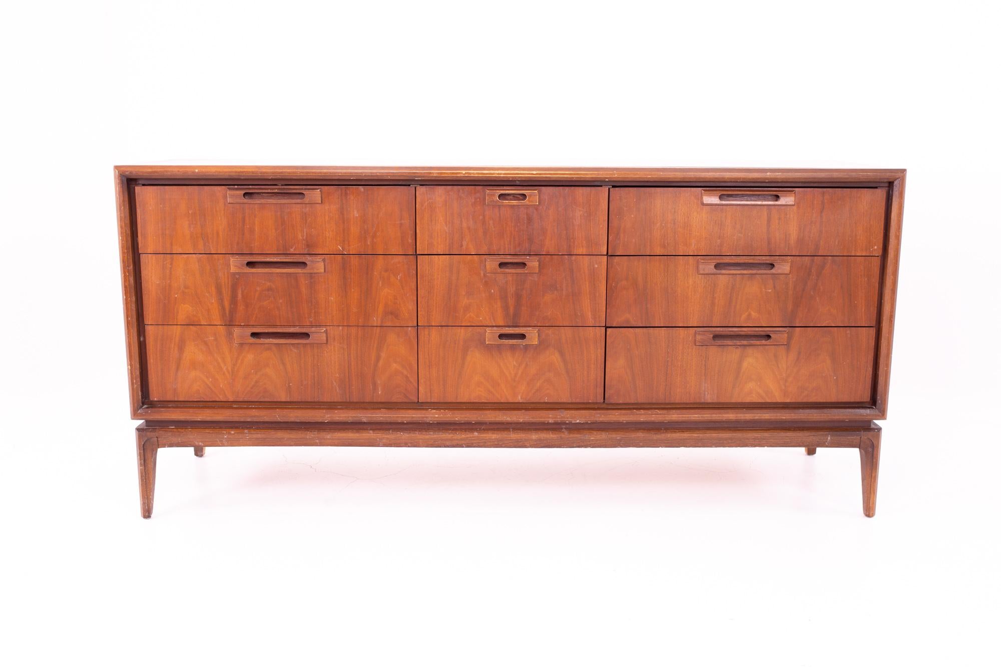 United Mid Century 9-drawer lowboy dresser
Dresser measures: 66 wide x 19 deep x 31.5 high
This price includes getting this piece in what we call restored vintage condition. That means the piece is permanently fixed upon purchase so it’s free of