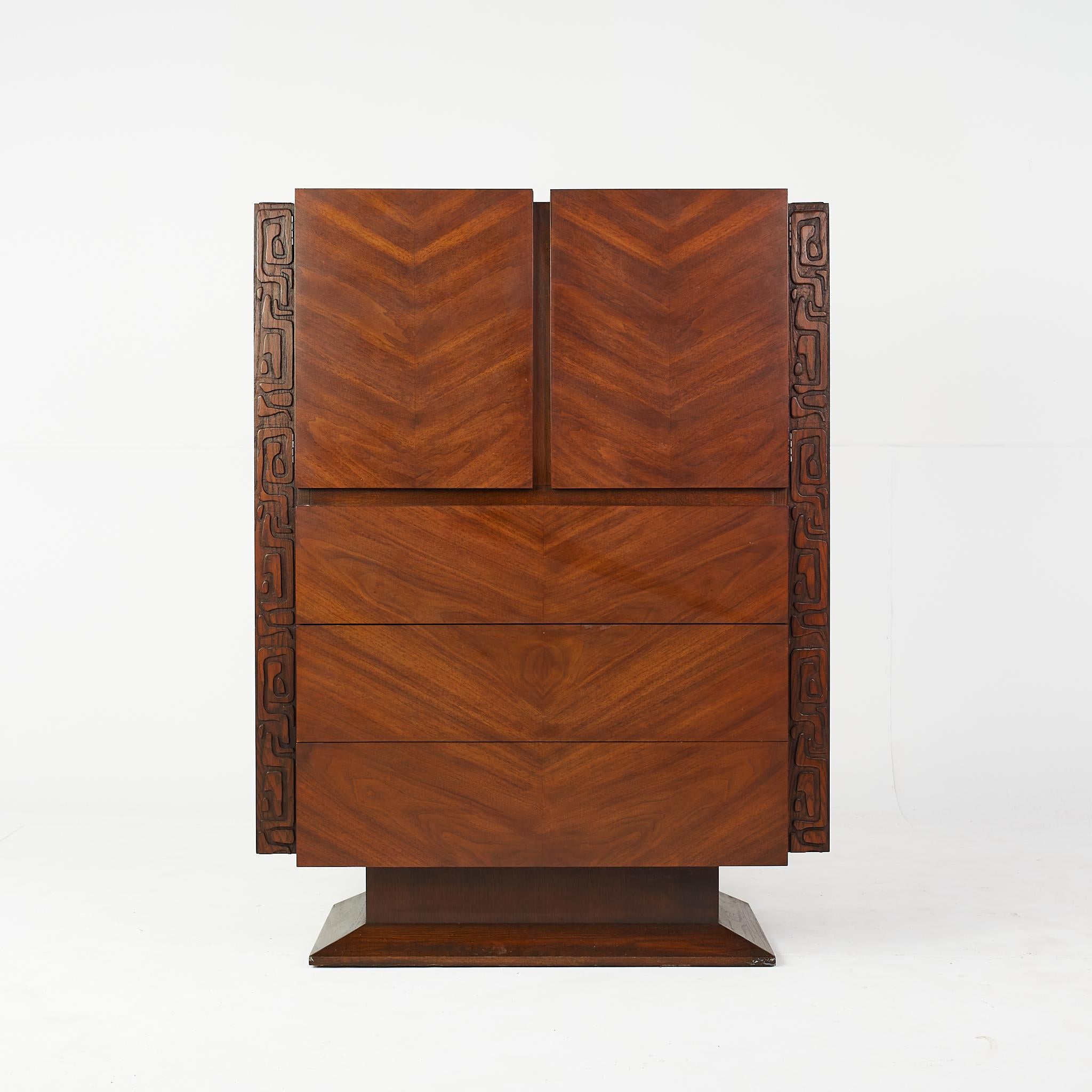 United mid century Tiki Brutalist highboy dresser

This dresser measures: 41 wide x 19 deep x 54 inches high

All pieces of furniture can be had in what we call restored vintage condition. That means the piece is restored upon purchase so it’s